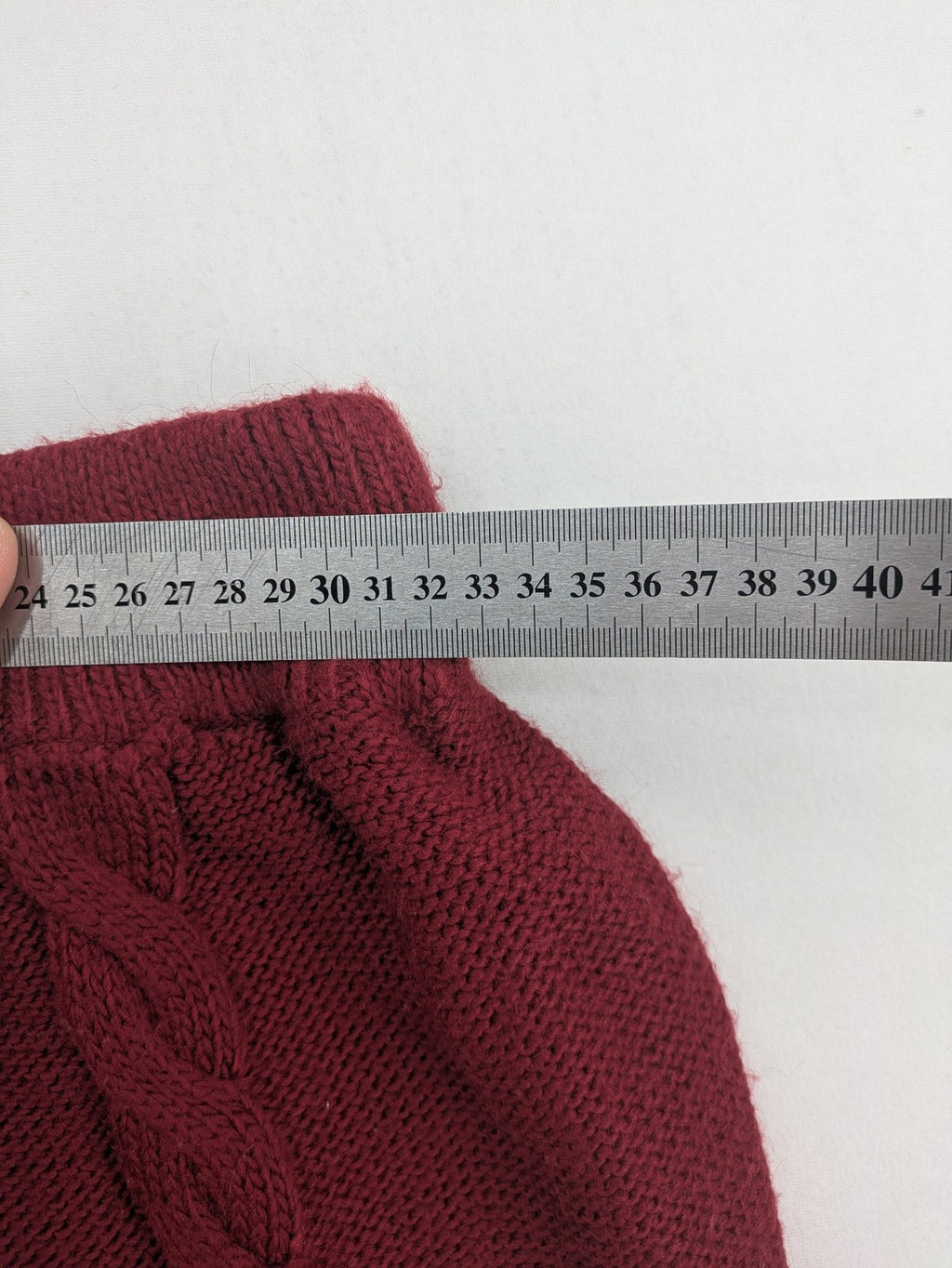 Pullover burgundy turtle neck jumper with diamond and cable knit patterns, elastic waistband.
