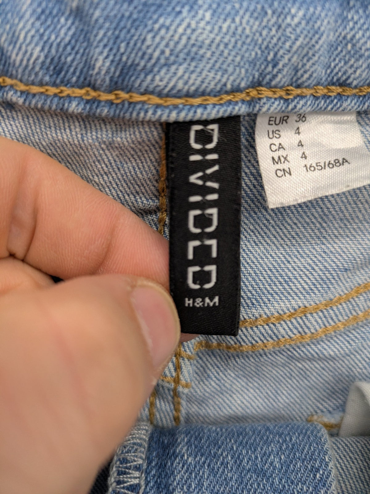 H&M Divided blue mom jeans high waist tapered fit with classic wash and durable cotton blend.
