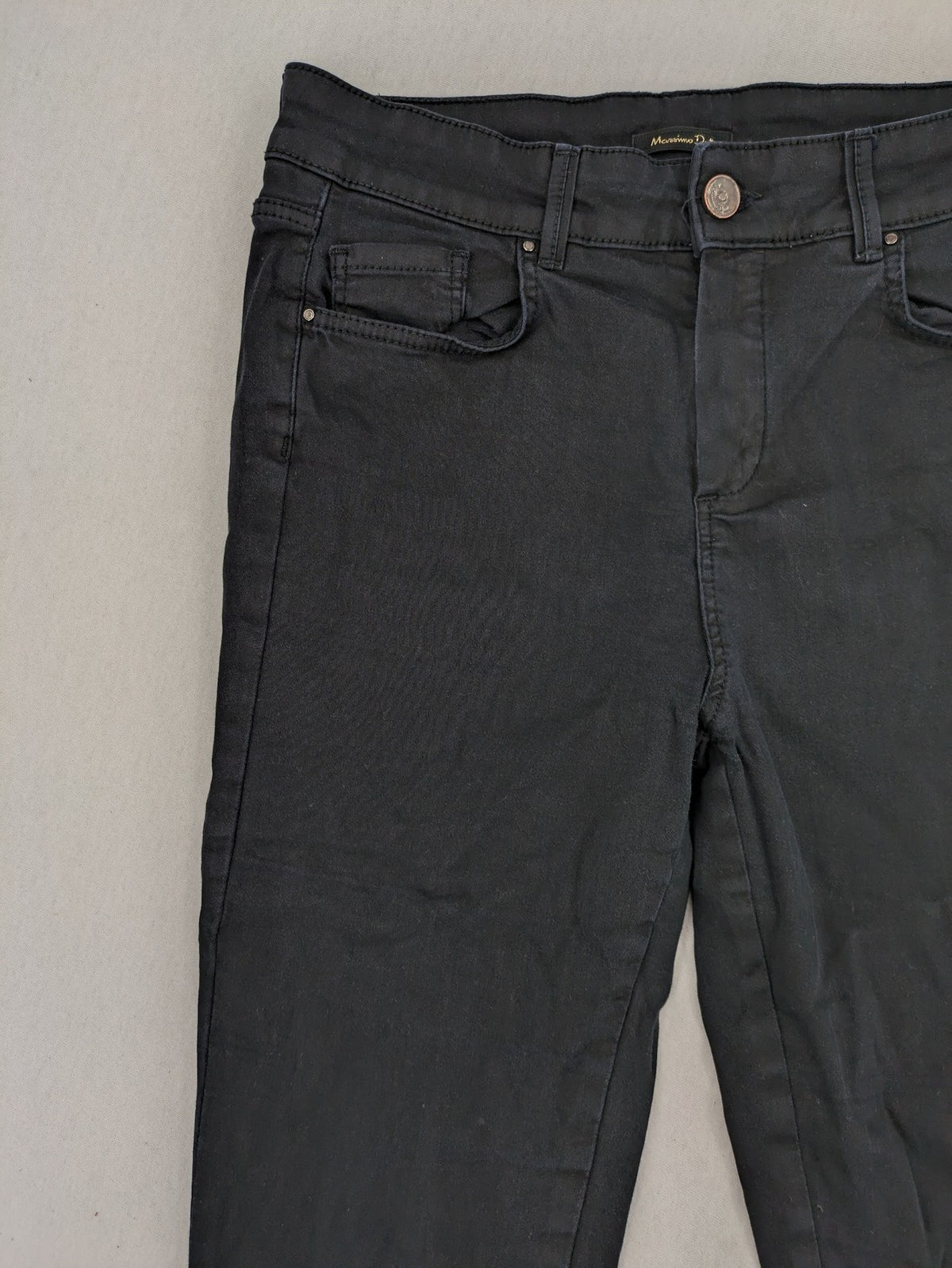 Massimo Dutti grey skinny fit jeans with coated finish and sleek silhouette.