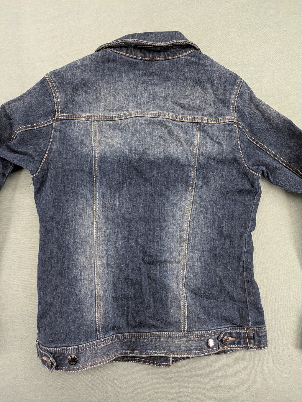 BLU blue denim trucker jacket with button placket and two chest pockets.
