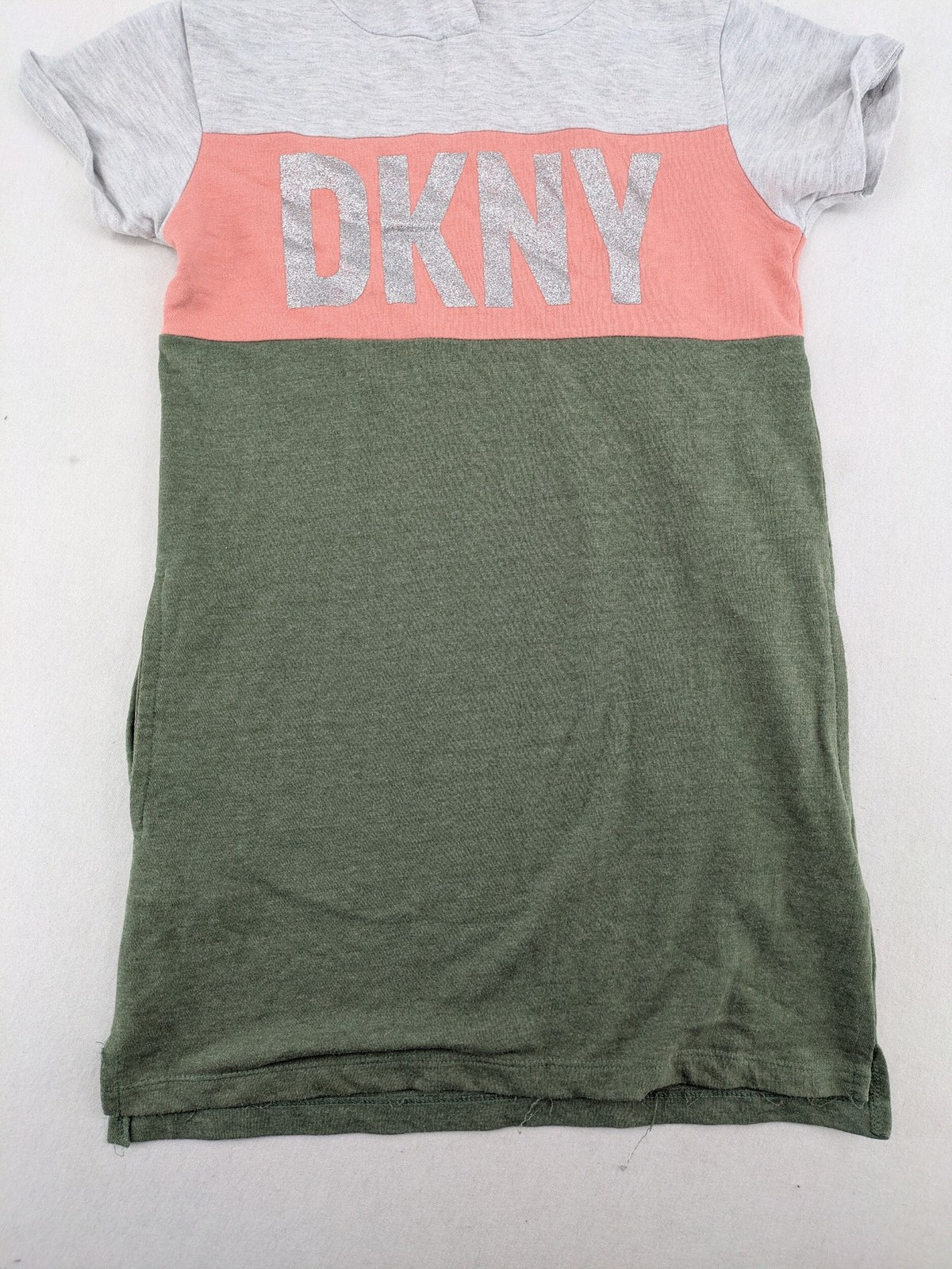 DKNY pink hoodie dress colorblock design with glitter logo and short sleeves.