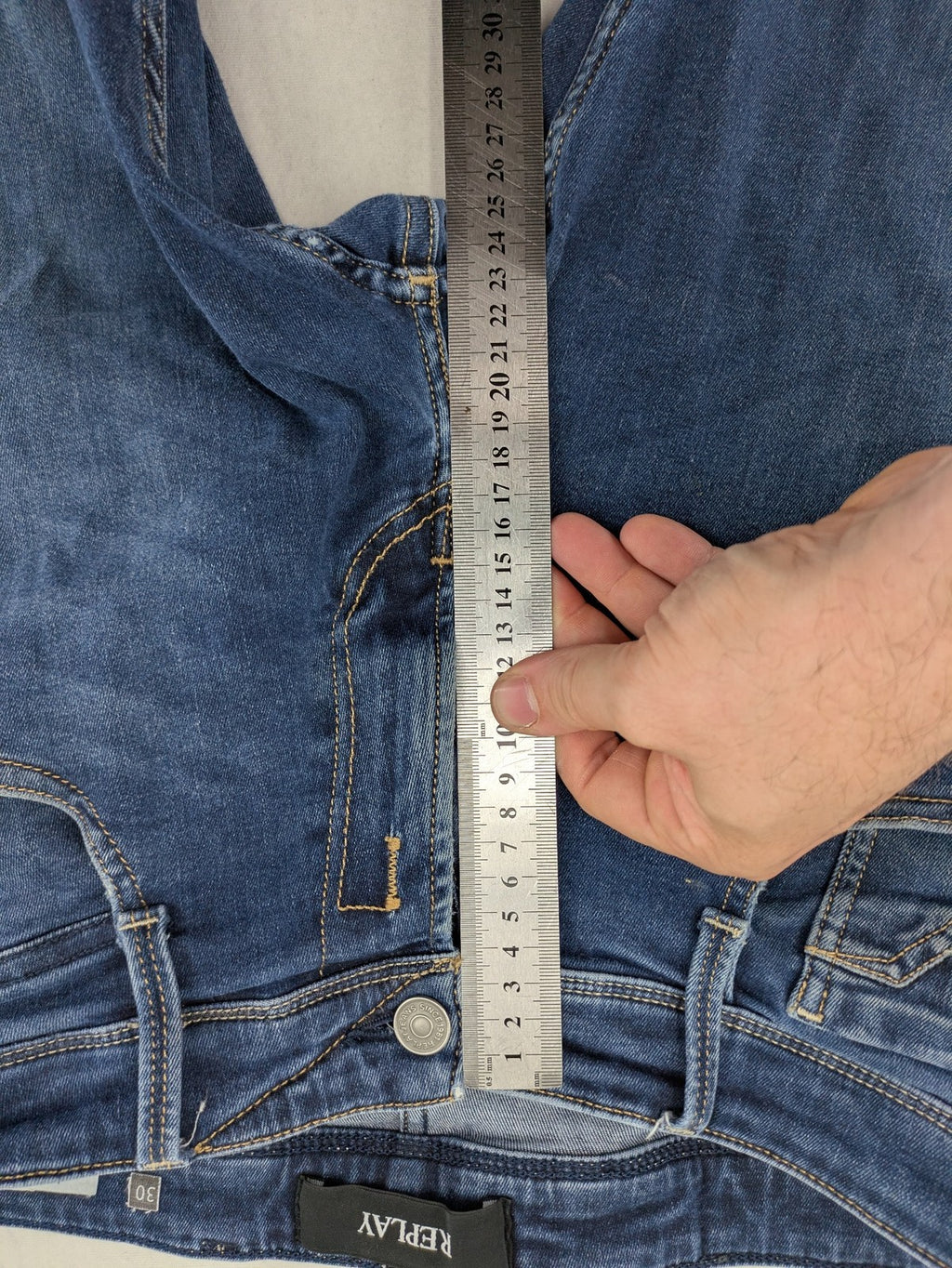Replay slim fit jeans blue with subtle fading and stretch denim material.