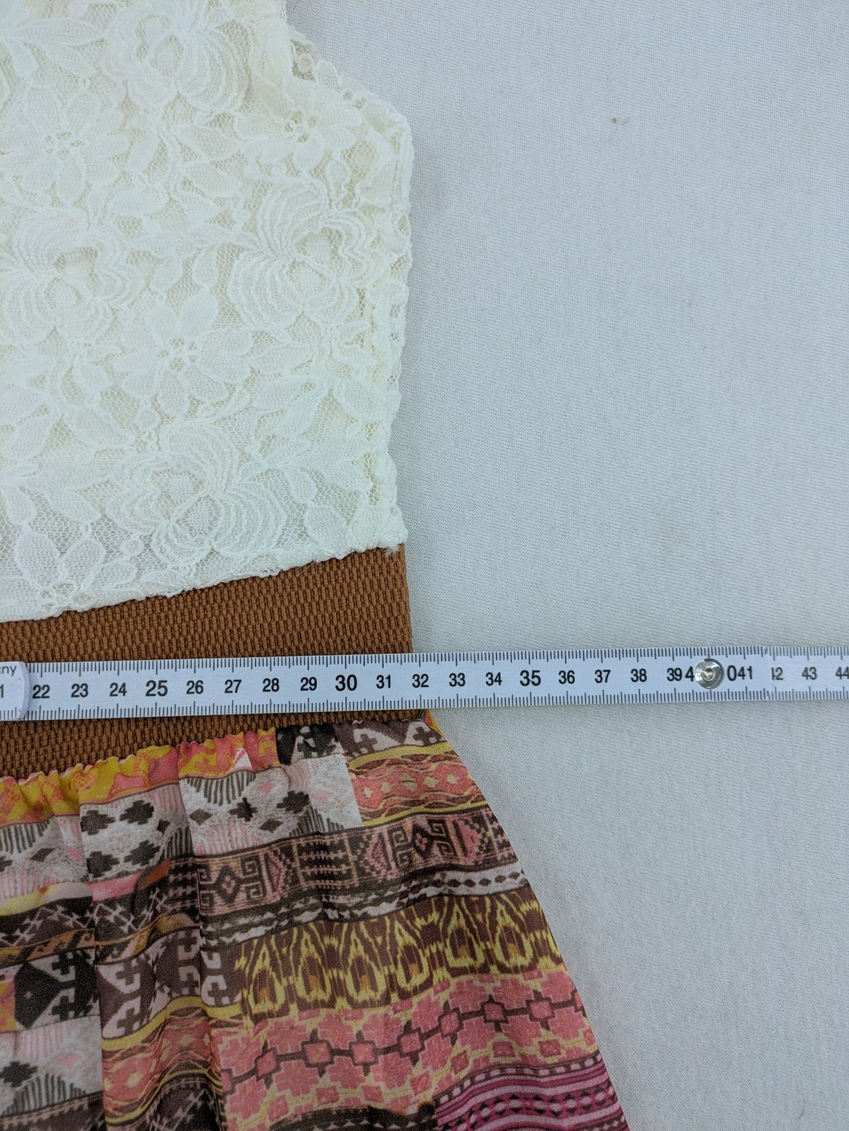 Boho multi summer dress white lace bodice with crossed straps and high-low hem.