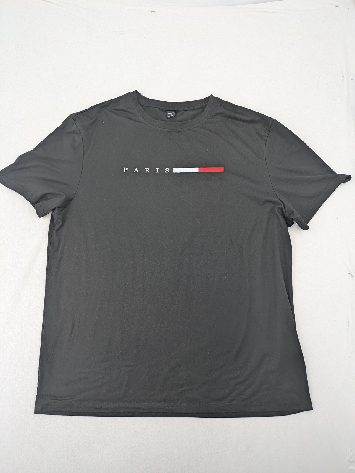 Manfinity loungewear set black T-shirt and shorts with Paris graphic print.