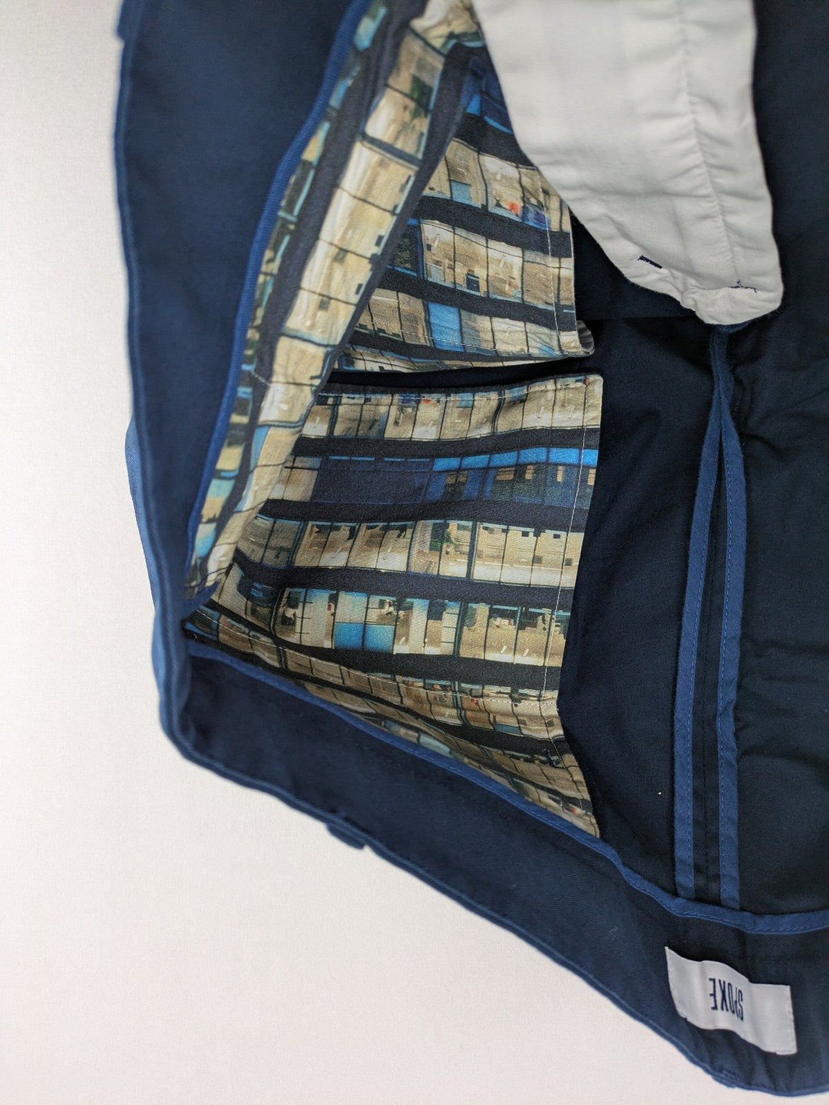 Spoke navy chino shorts flat front with unique printed pocket lining.