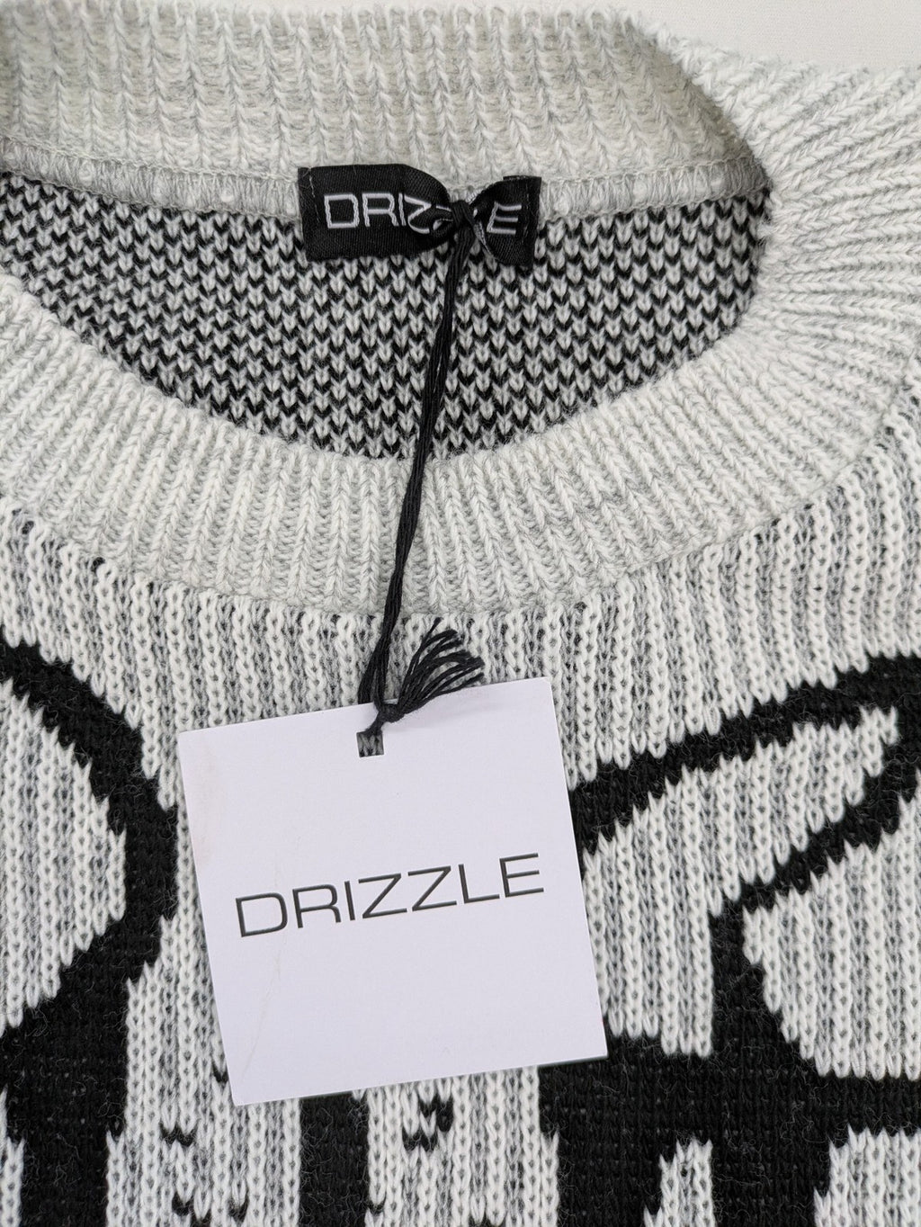 Drizzle turtle neck jumper black grey with abstract graphic print and distressed details.