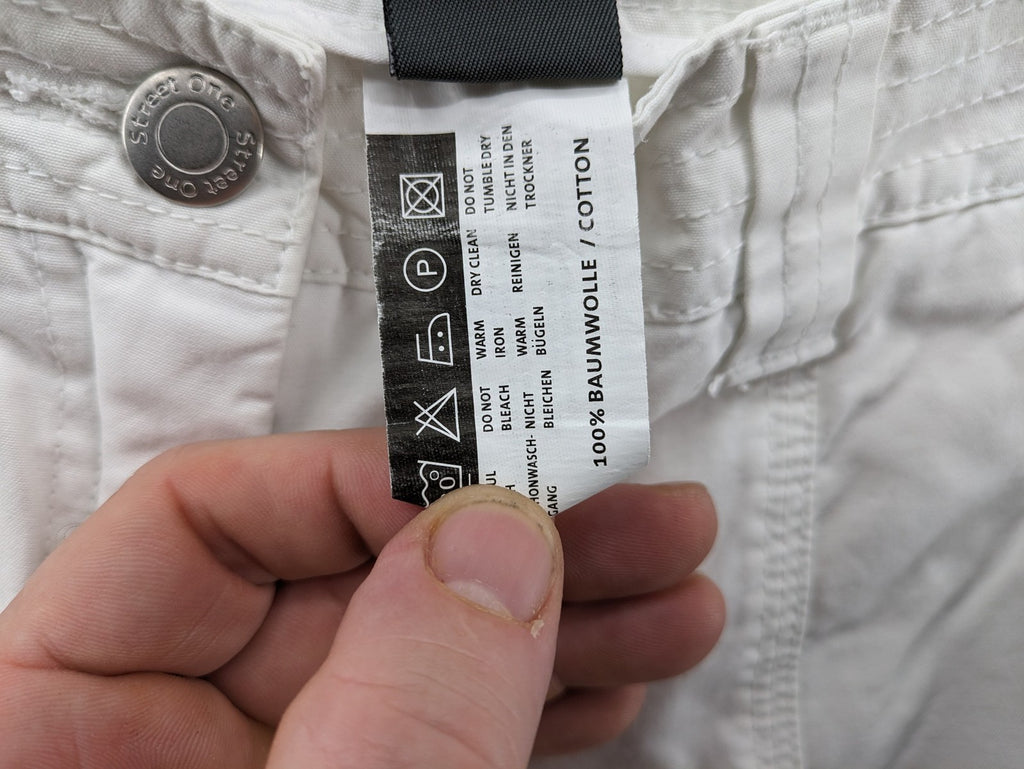Street One white cargo pants with side pockets and wide leg design.