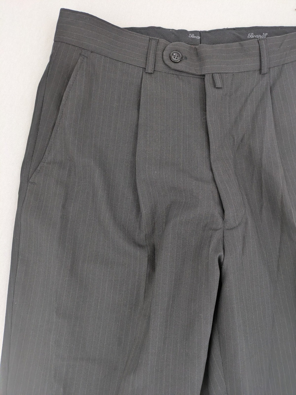 Wahl grey dress pants with pinstripe pattern and pleats, featuring side and back pockets.