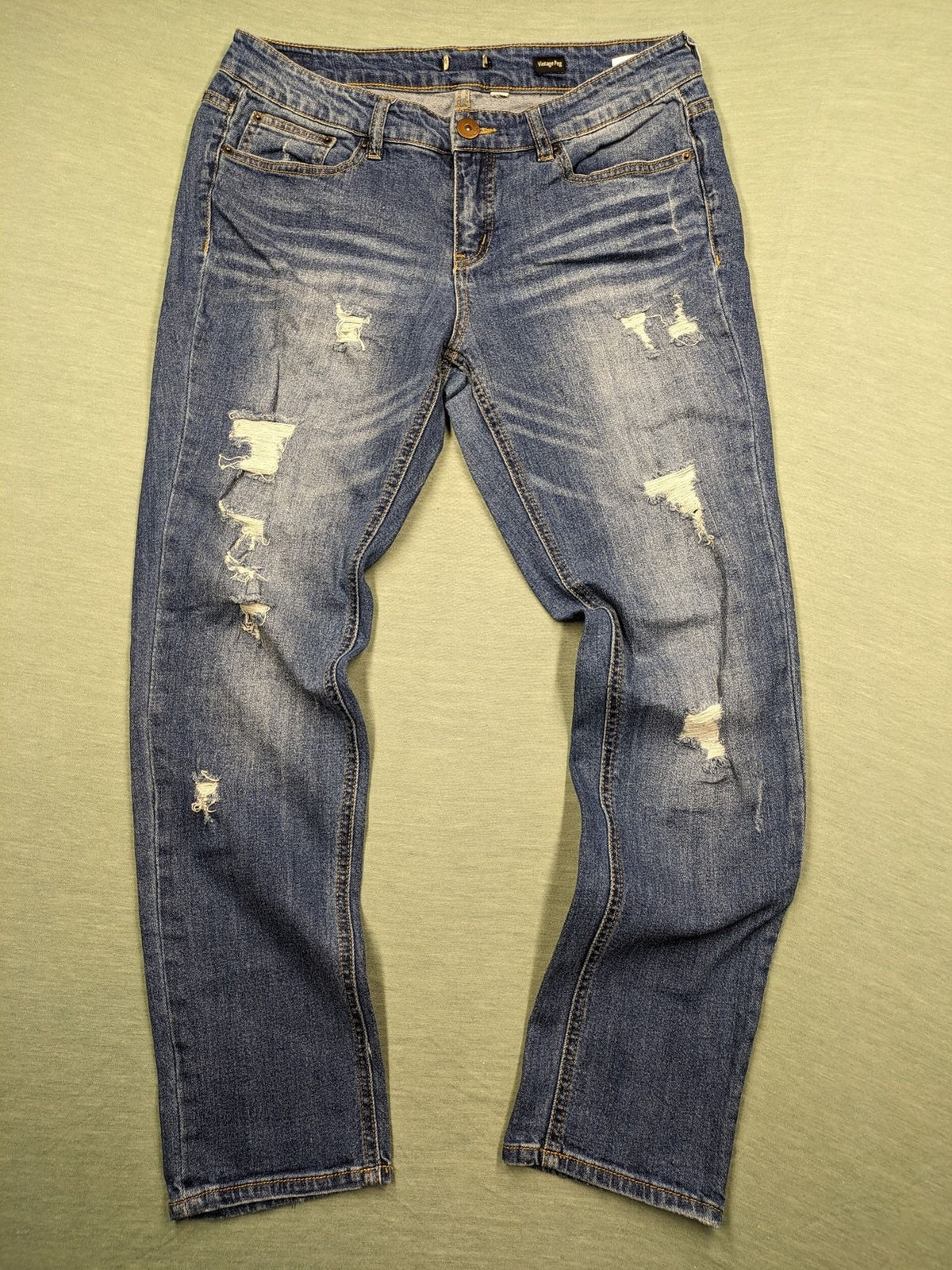Peg blue ripped straight jeans with distressed details and comfortable stretch material.