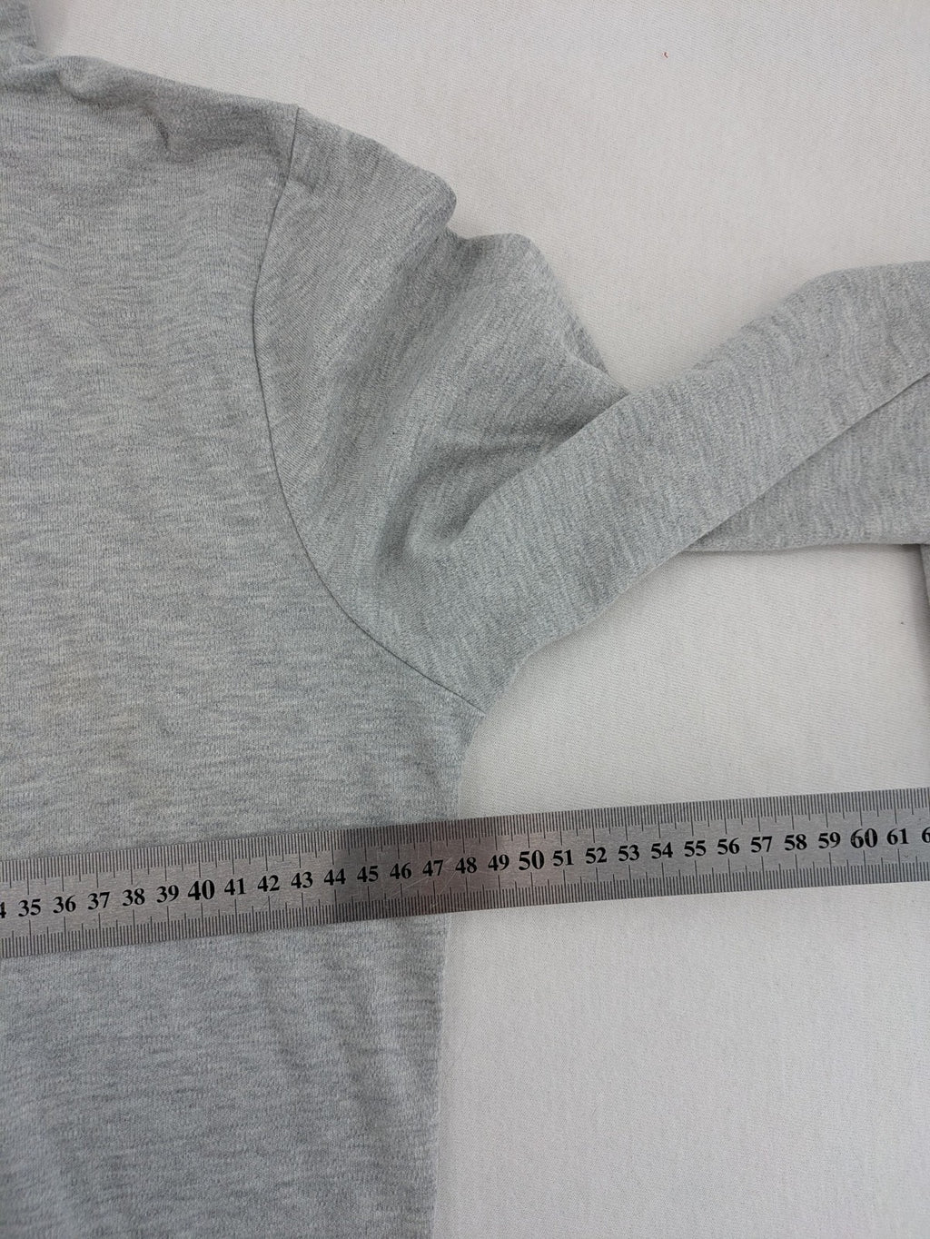 Colours Of The World grey knit jumper with pink drawstring, inspirational graphic print, soft material.