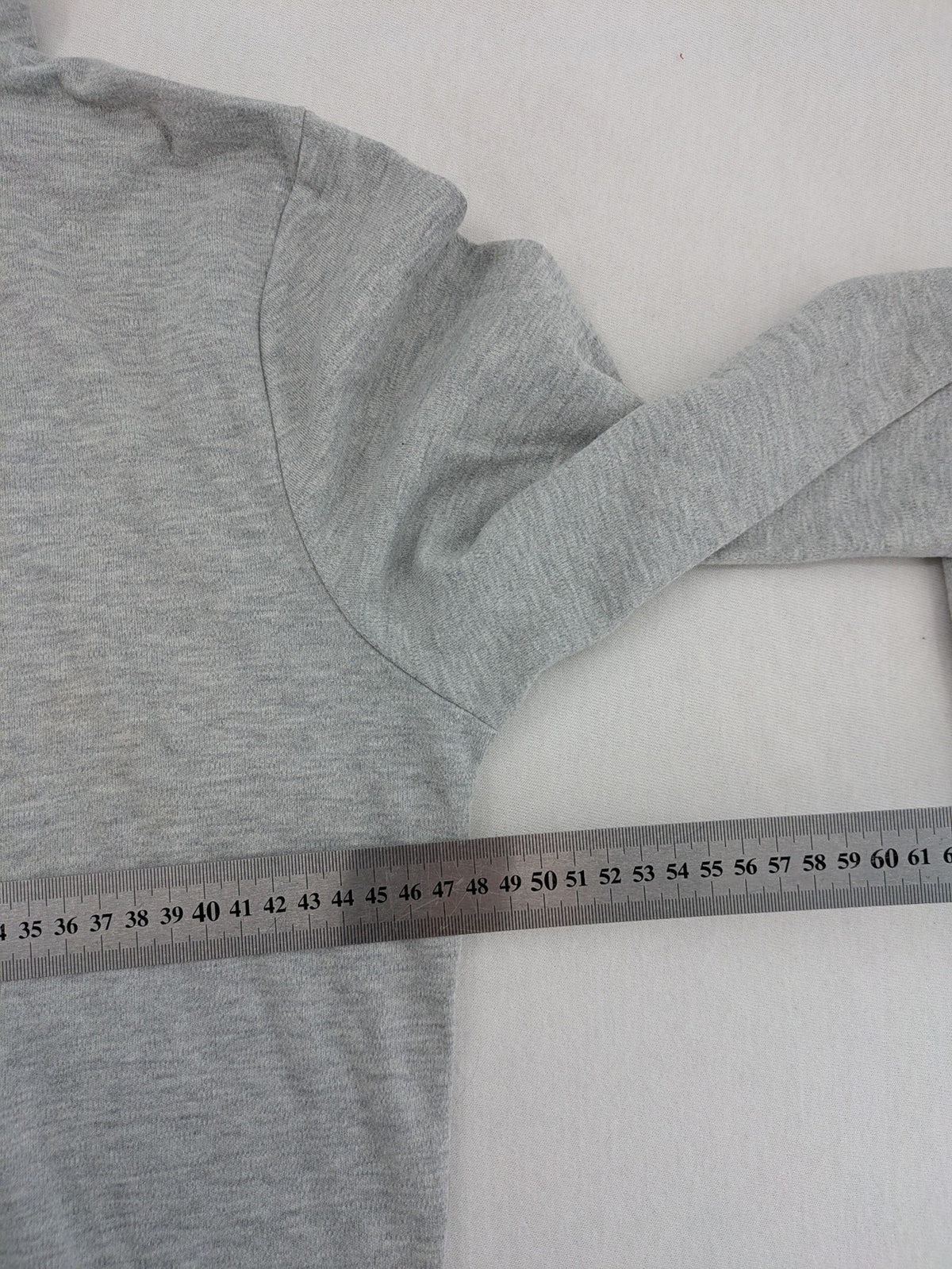 Colours Of The World grey knit jumper with pink drawstring, inspirational graphic print, soft material.