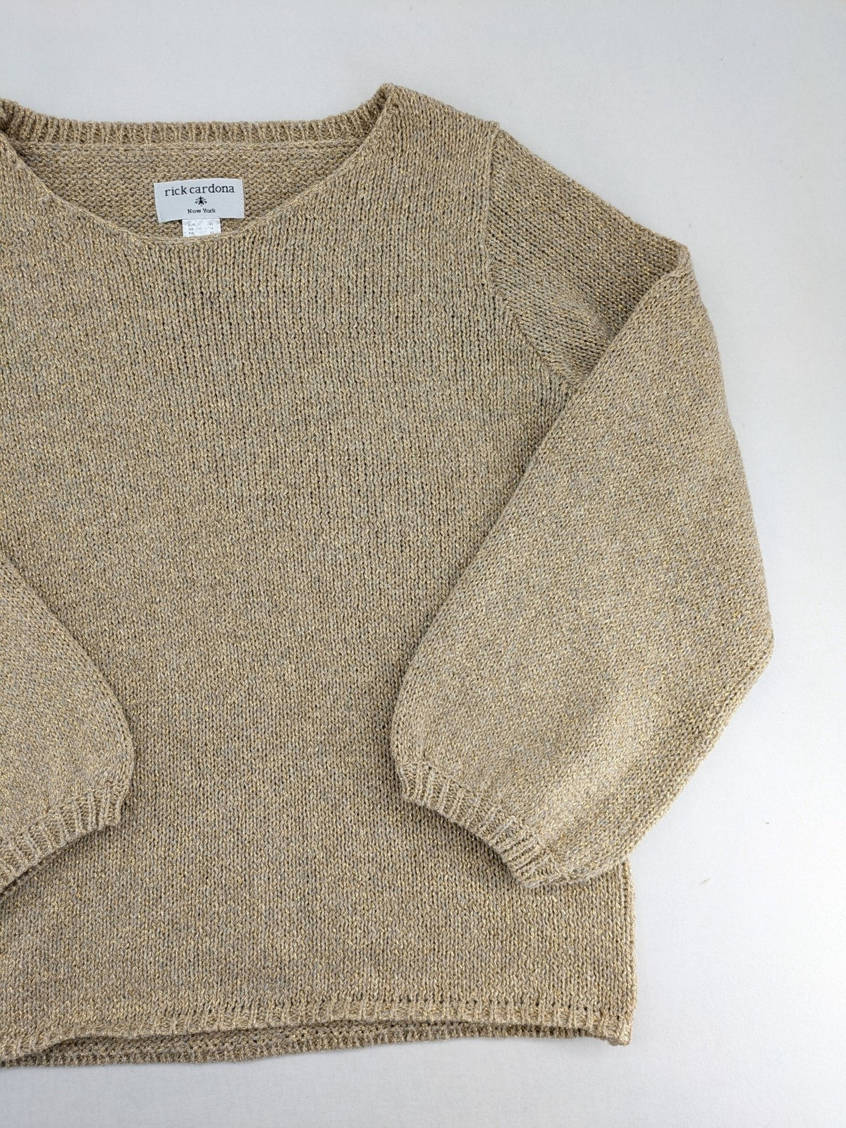Rick Cardona beige turtle neck jumper with gold metallic thread and balloon sleeves.