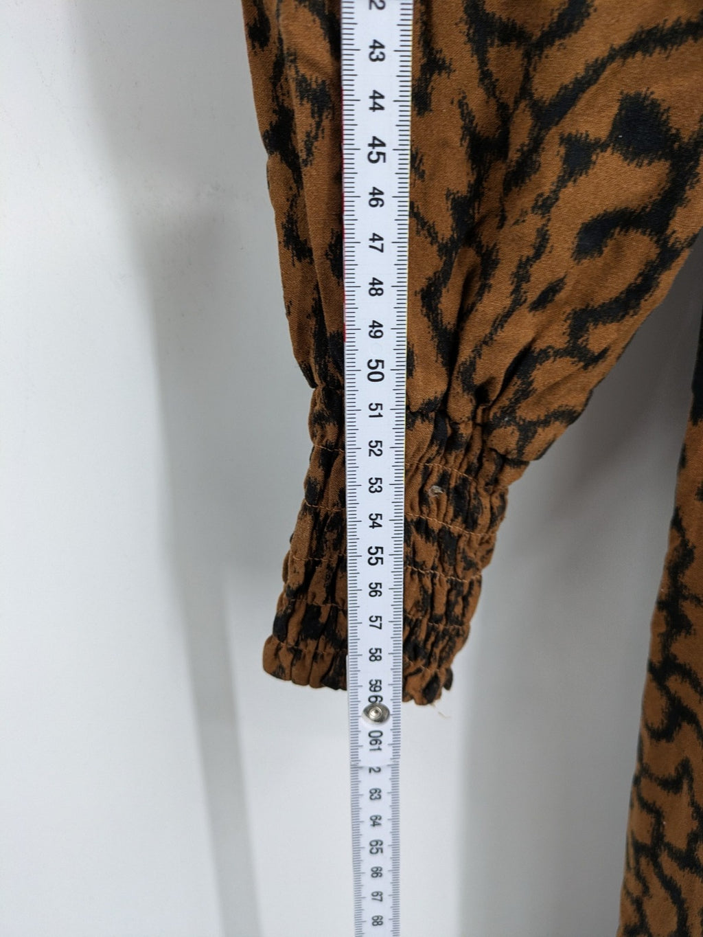 H&M brown and black animal print midi dress with smocked bodice and square neckline.