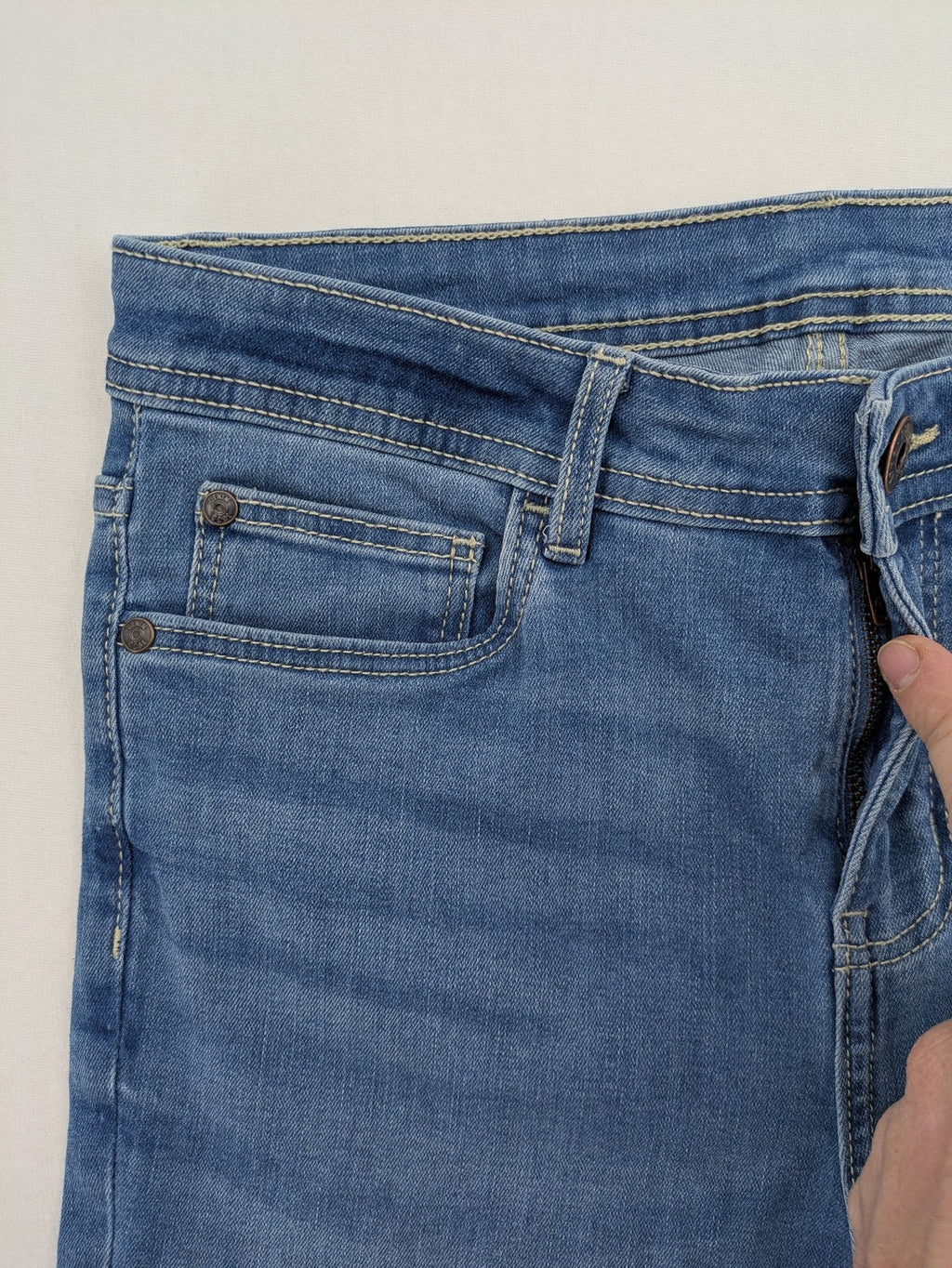 ESMARA blue super skinny jeans with medium waist and stretchy cotton blend material.