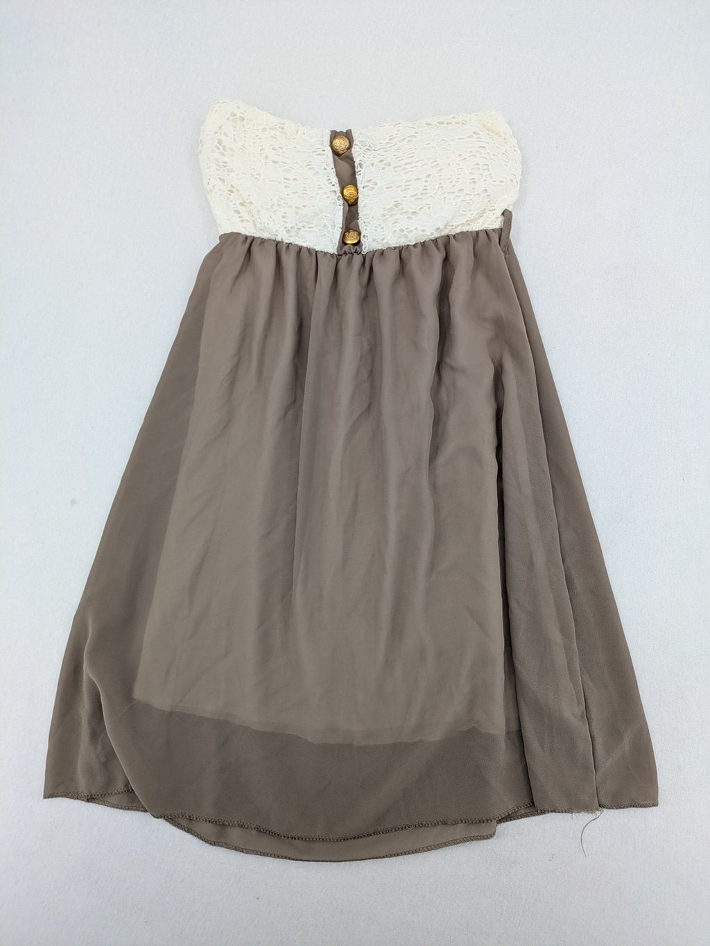 Creme bandeau summer dress in taupe with lace top and decorative gold buttons.