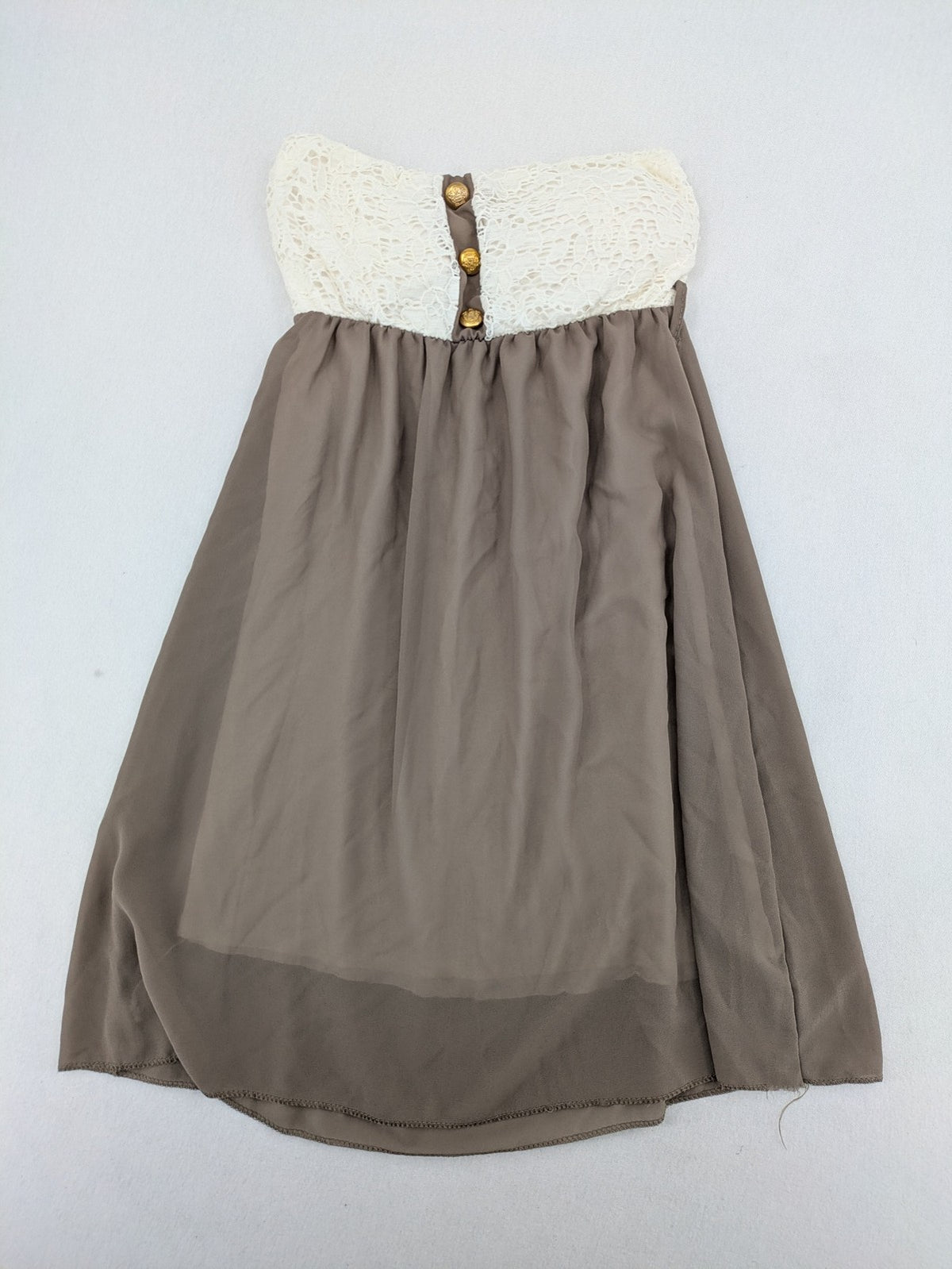 Creme bandeau summer dress in taupe with lace top and decorative gold buttons.