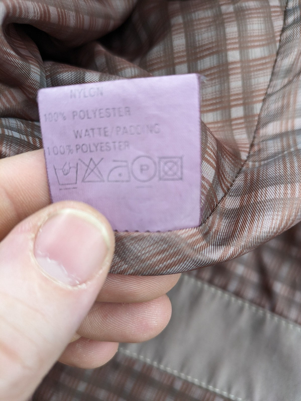 Goldix beige coat with checkered lining and Sympatex waterproof technology.