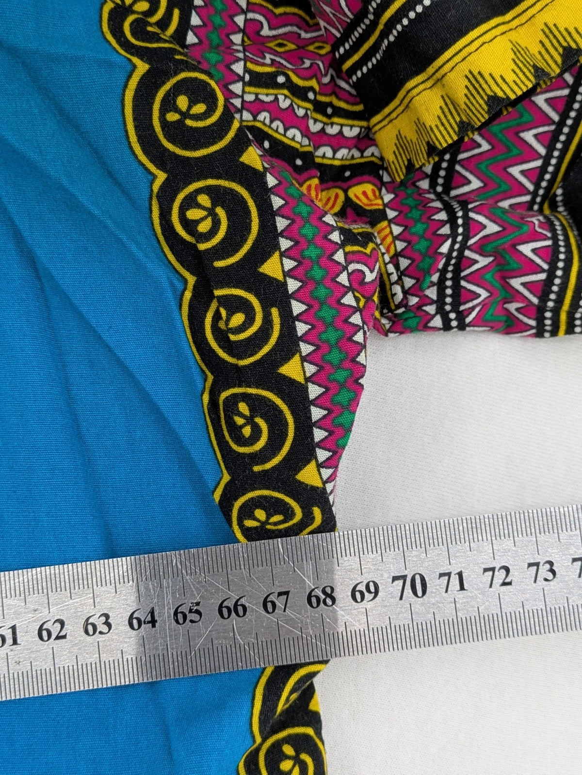 M/L multi Dashiki shirt with vibrant ethnic print on light blue cotton fabric.