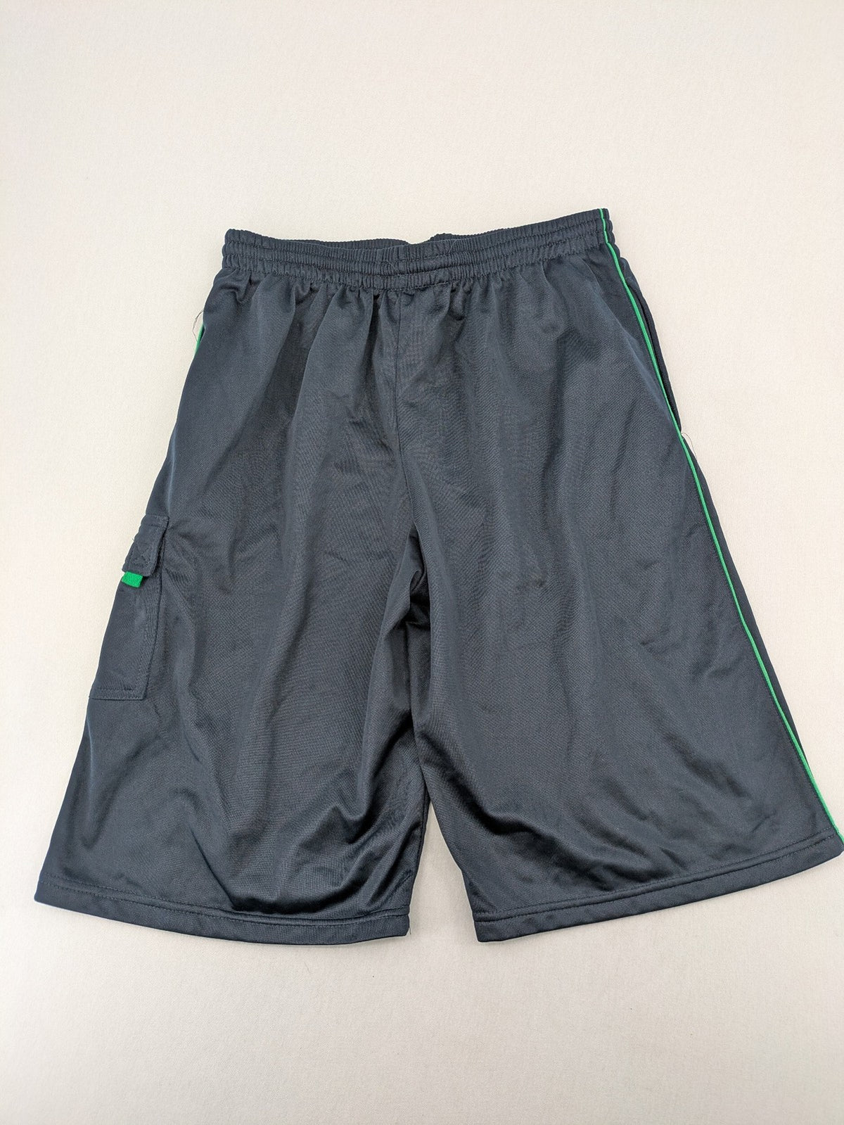 okay grey cargo shorts with green "ATHL. 5 DIVISION" graphic print and side pocket.