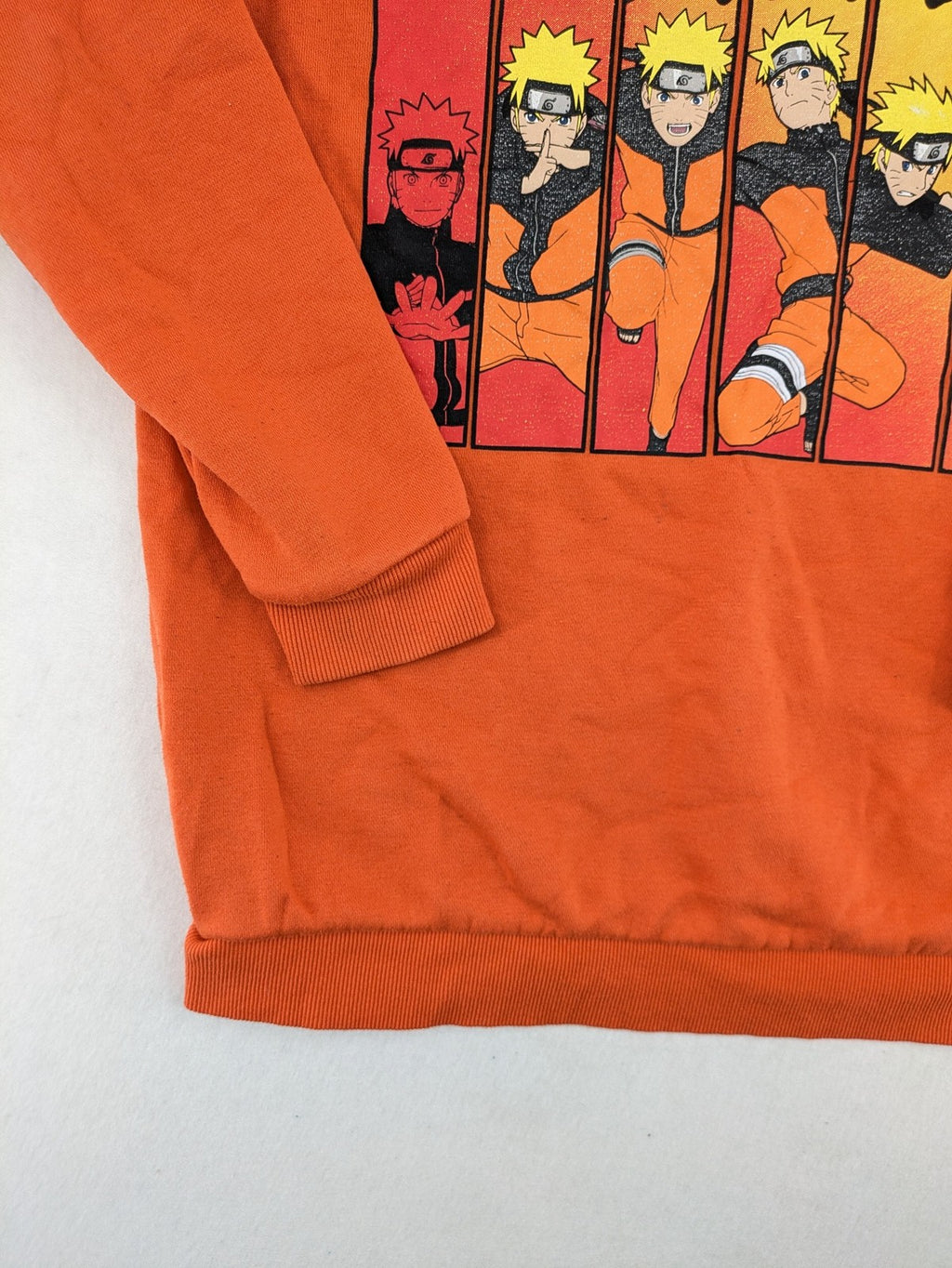 Naruto Shippuden orange sweatshirt featuring vibrant Naruto Uzumaki graphic print, classic crew neck.
