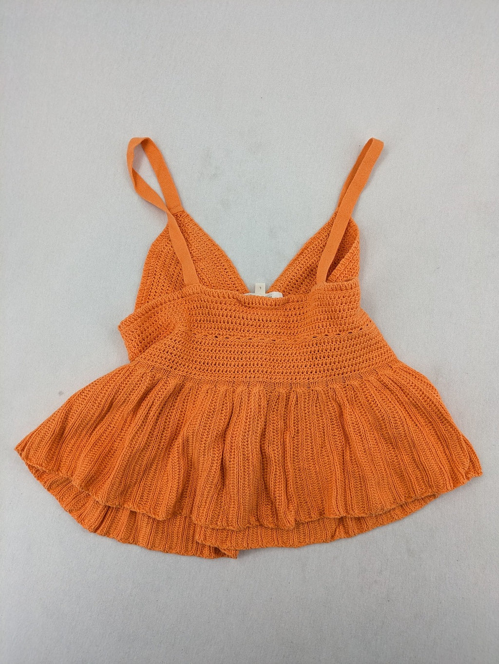 REVIEW orange crochet top with V-neck and peplum hem, made from 100% cotton.