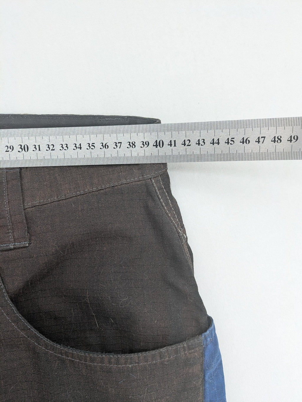 Kübler work pants blue grey Cordura fabric with multiple cargo pockets and reflective details.