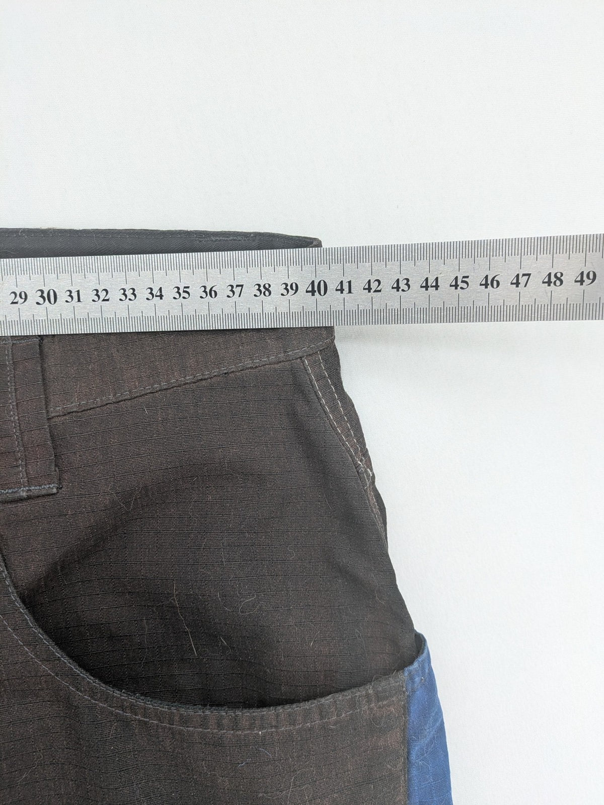 Kübler work pants blue grey Cordura fabric with multiple cargo pockets and reflective details.