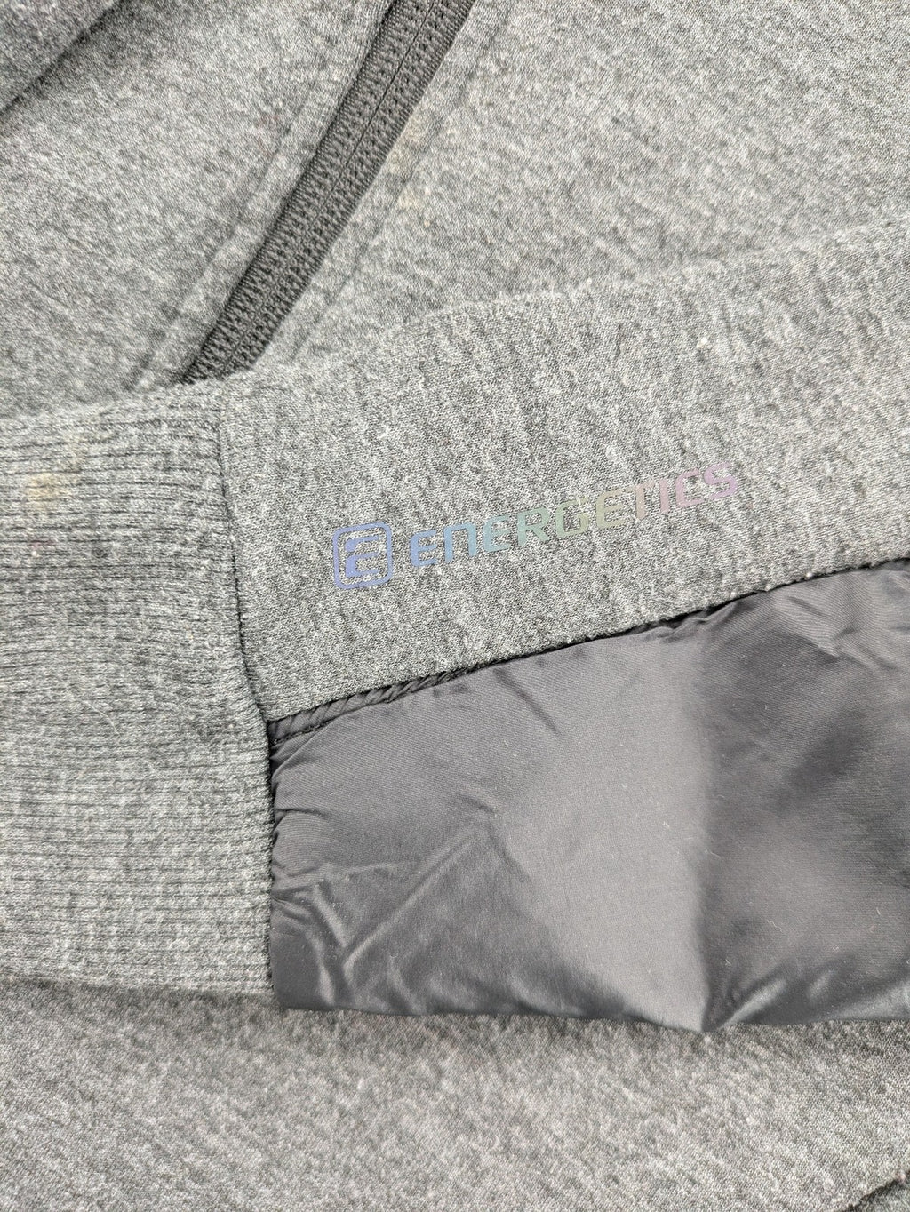 Energetics hybrid jacket black grey with High Peak patch and zip-up design.