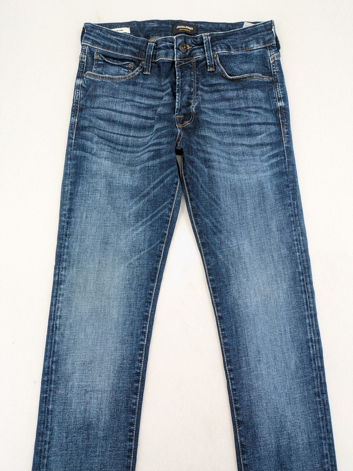 Jack & Jones blue slim fit jeans with faded wash and classic button fly.