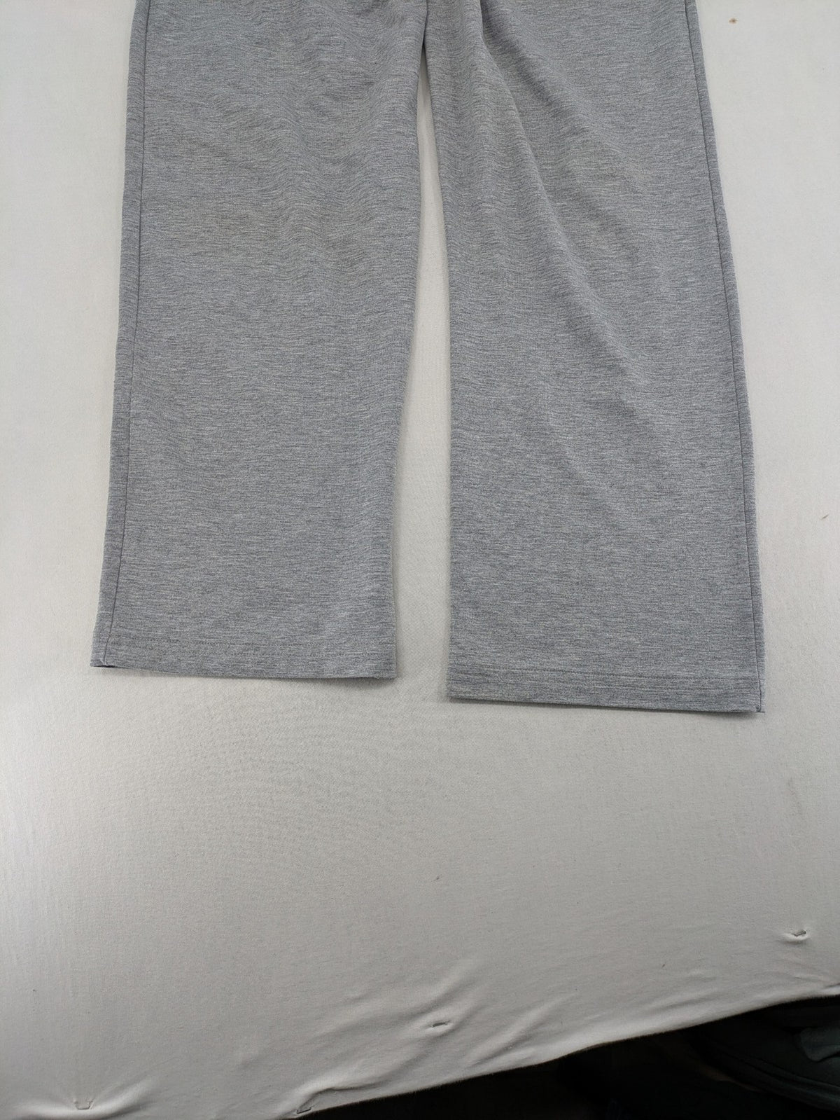 Falconhill grey jogging pants with elastic waistband, drawstring, and stylish black accent pockets.