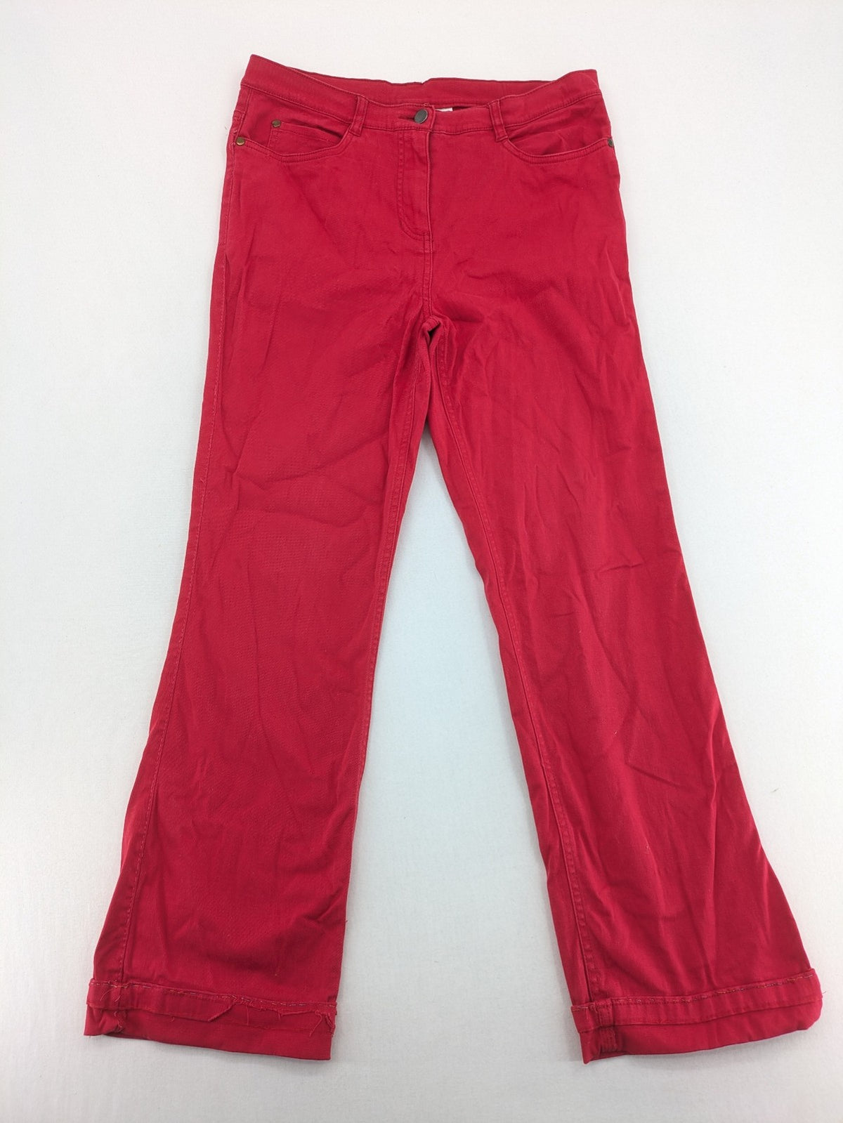 Jet Line red bootcut jeans with embroidered back pockets and pearl embellishments.