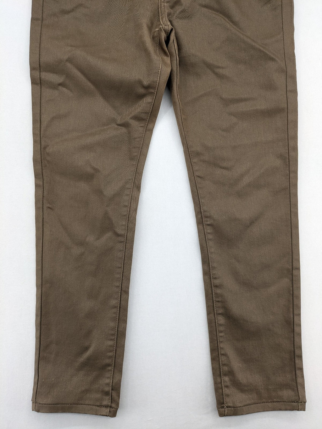 Vavell khaki skinny jeans five-pocket design with unique front zipper detail.