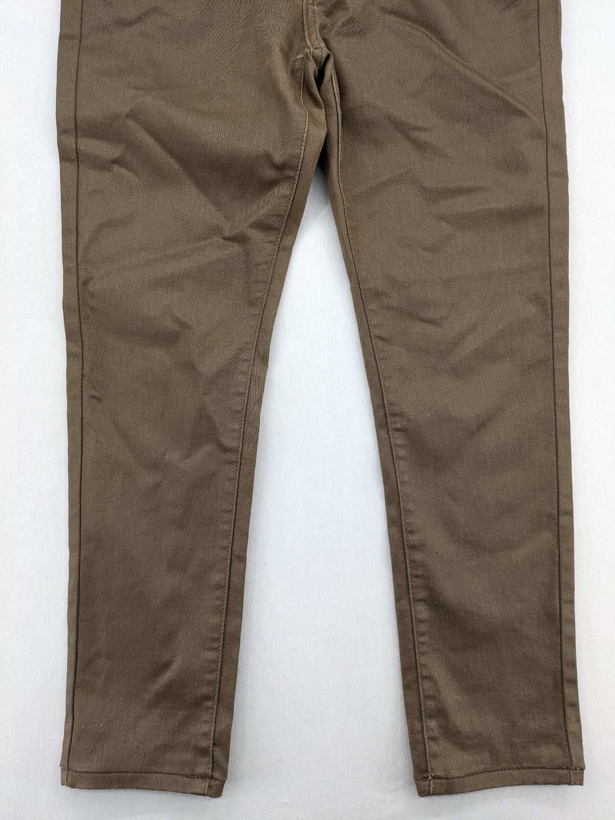 Vavell khaki skinny jeans five-pocket design with unique front zipper detail.