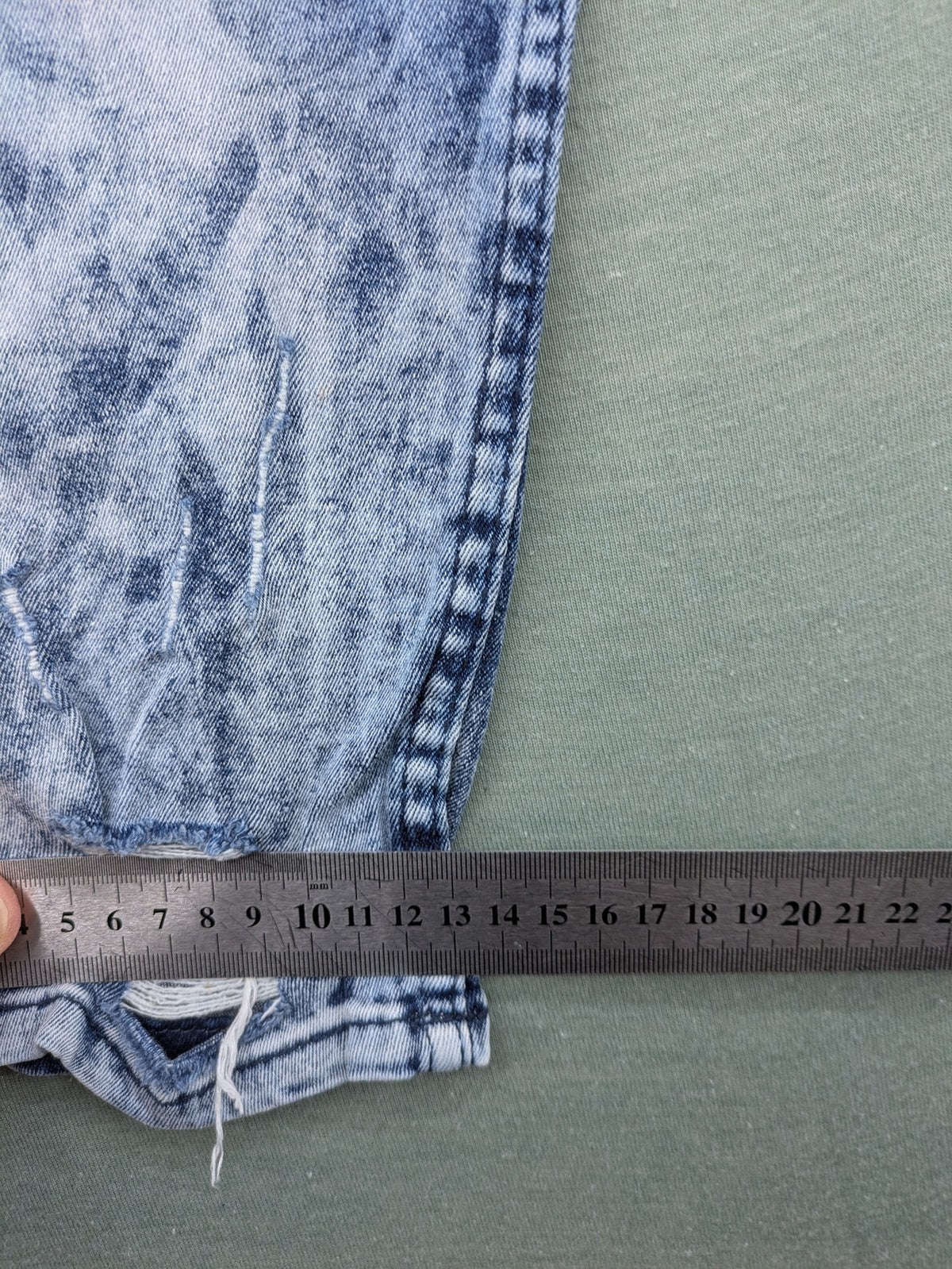Stark straight jeans multi distressed acid wash with orange patches and side stripes.