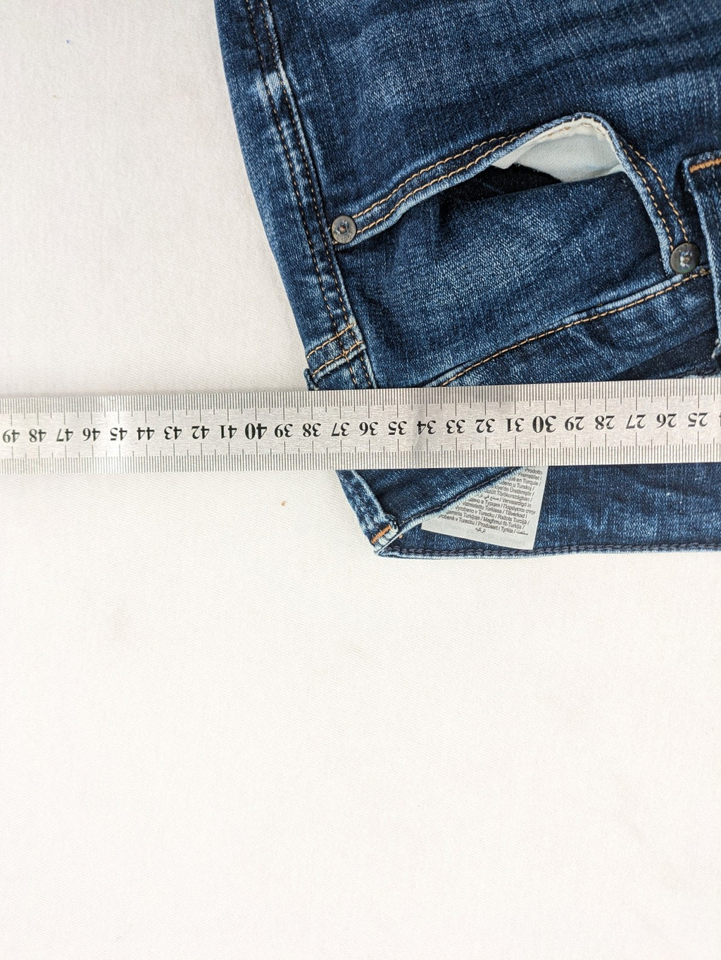 Jack & Jones blue slim fit jeans with faded wash and classic button fly.