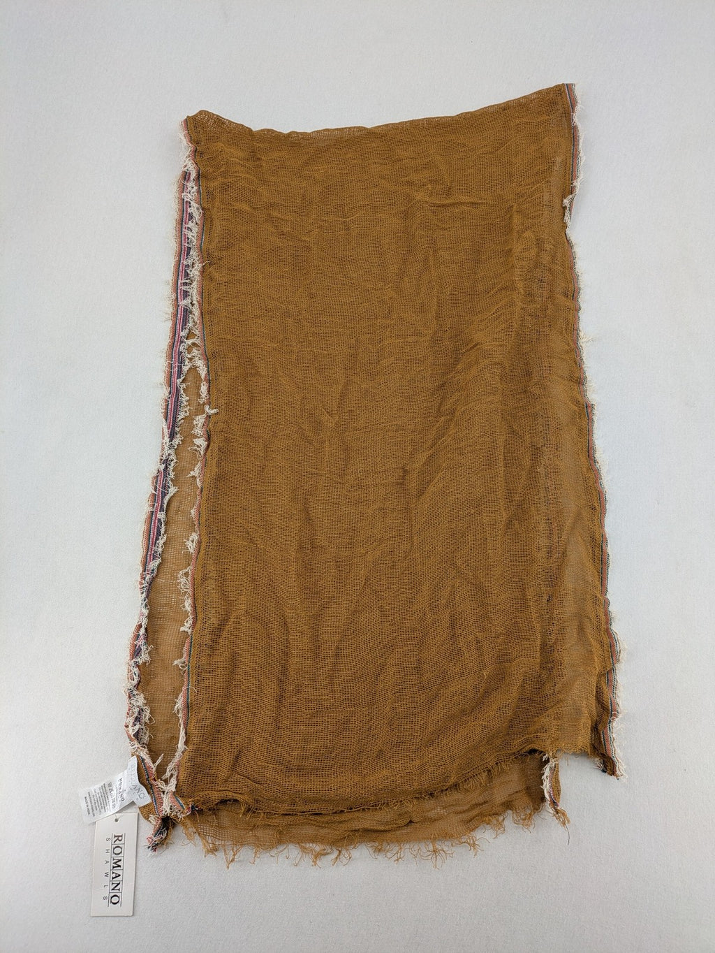 Romano multi scarf ocker with multicolored striped border and fringed edges.