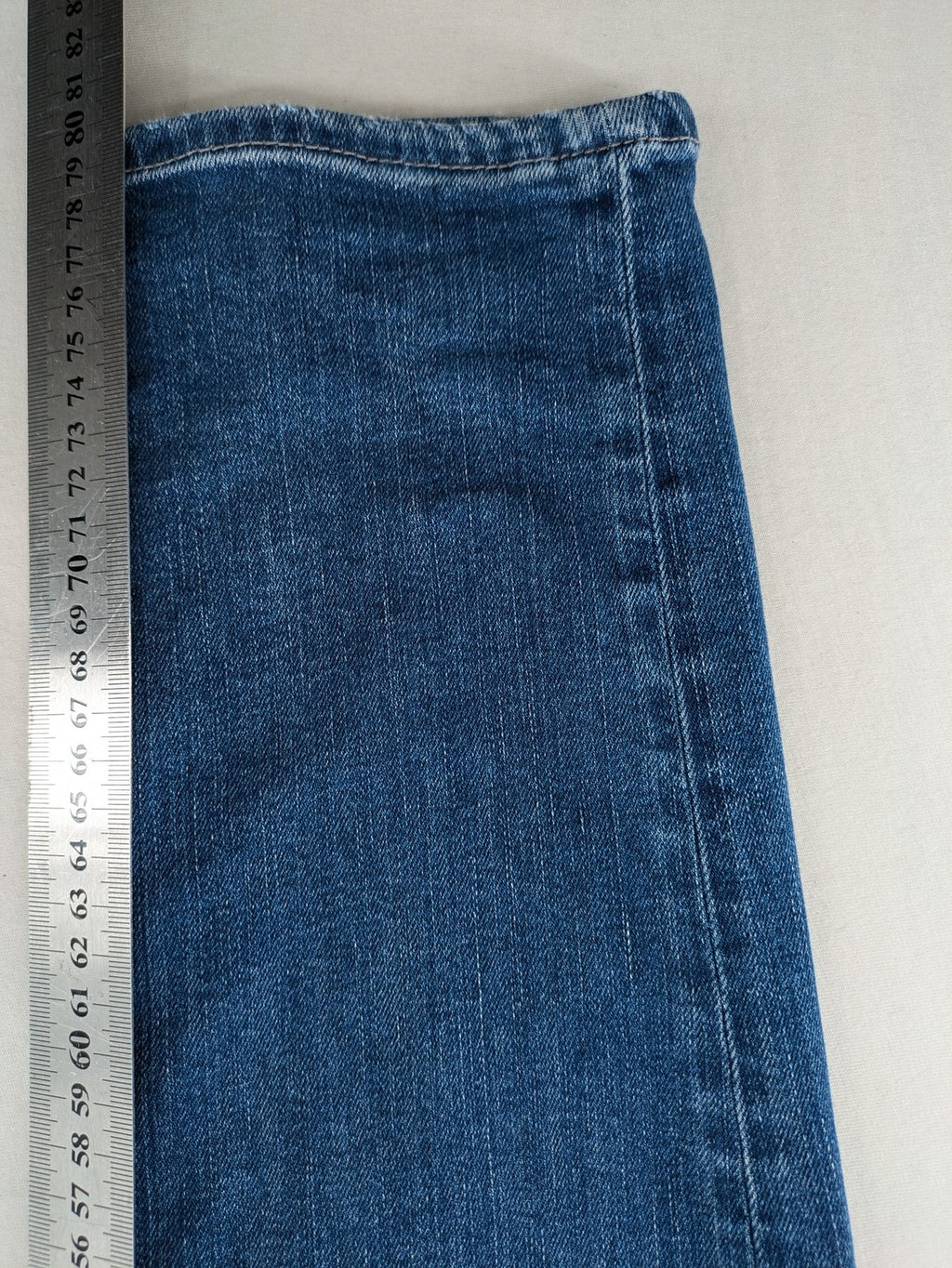Mavi blue straight leg jeans with classic 5-pocket styling and medium wash.