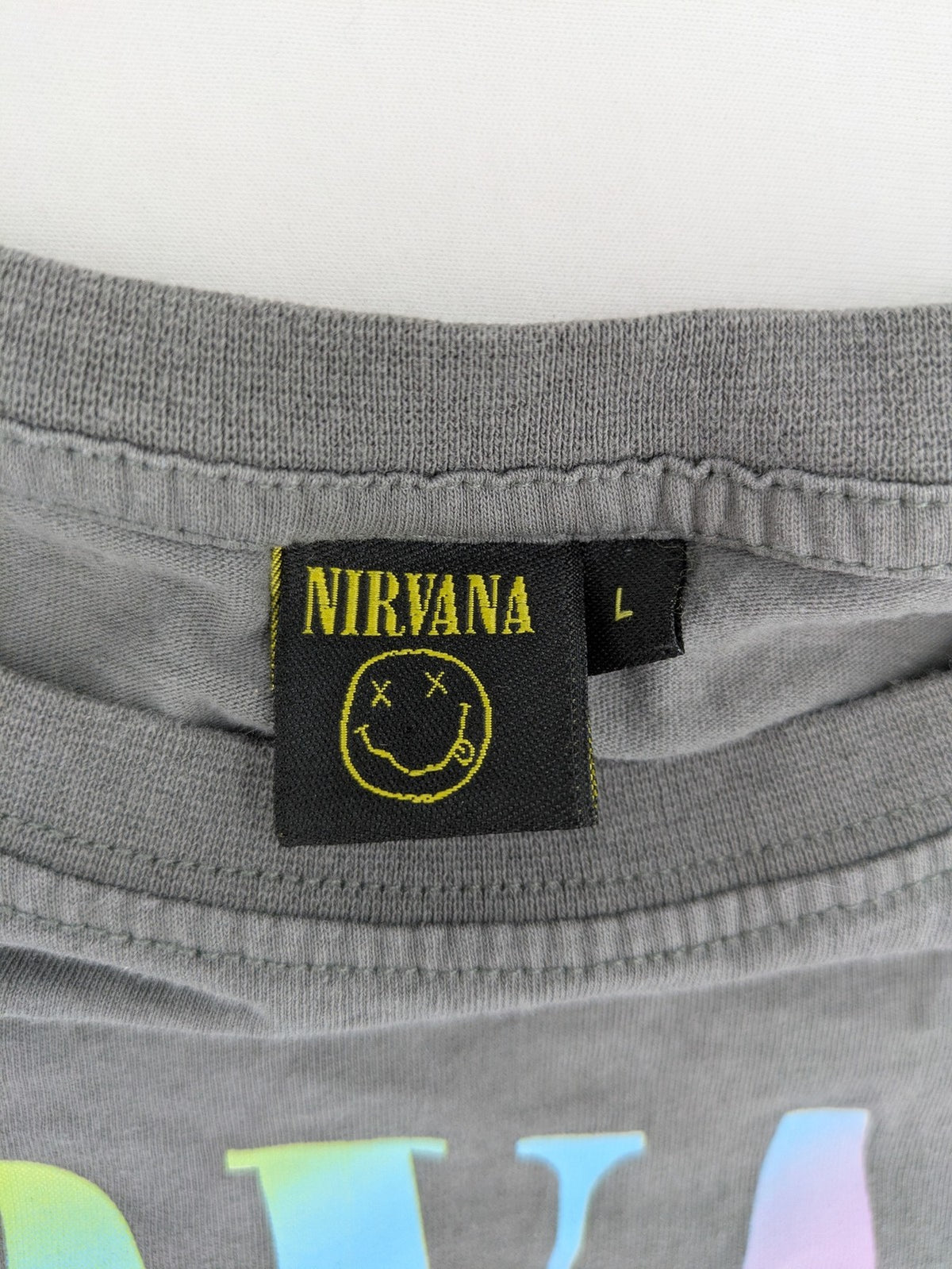 Nirvana grey t-shirt with rainbow Smiley logo and "Come As You Are" text.