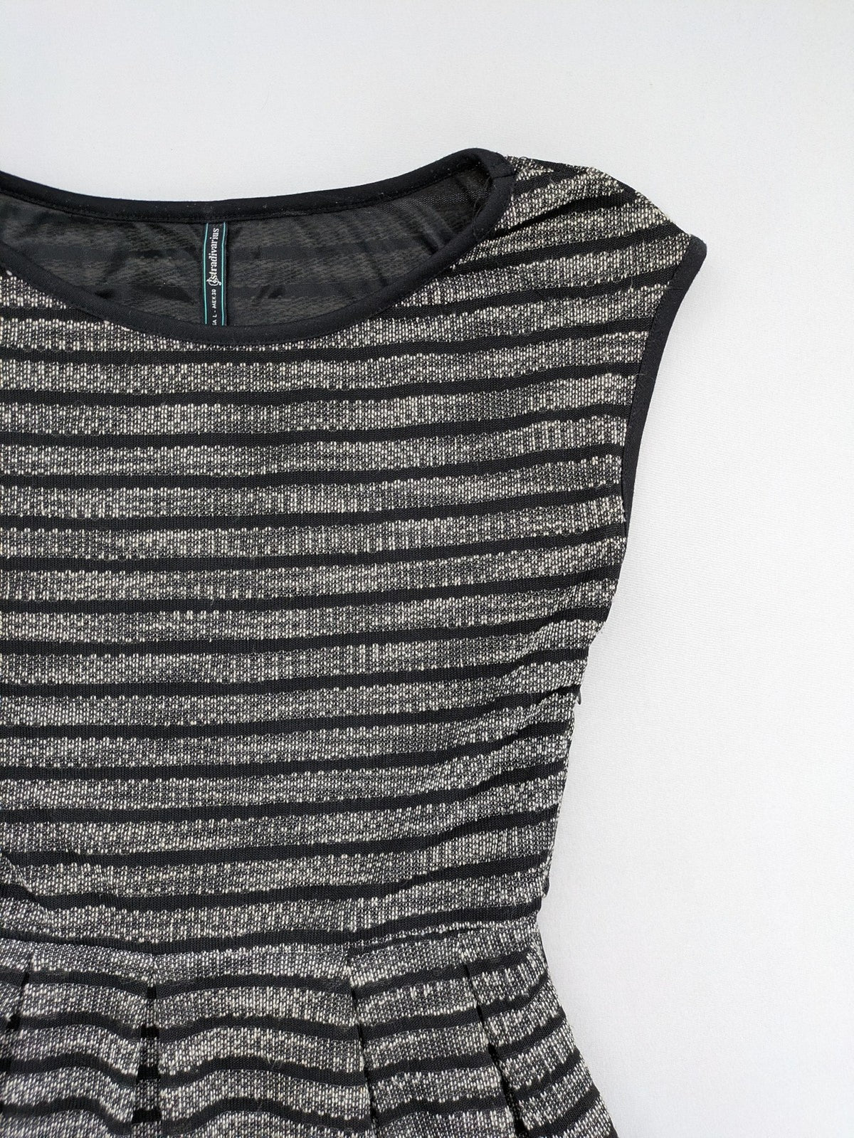 Stradivarius black and silver metallic fit and flare dress with sleeveless design and round neckline.