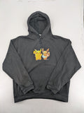 Pokémon black hoodie featuring colorful Pikachu and Evoli graphic, classic pullover style.