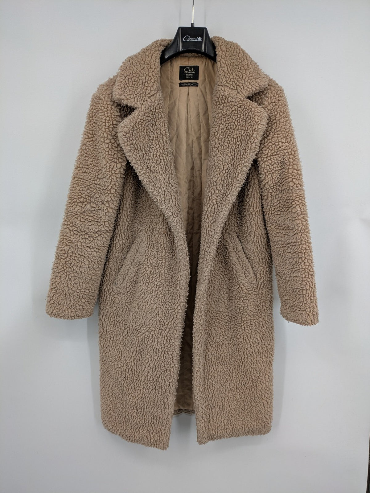 Clockhouse beige teddy coat longline design soft faux fur material with notched collar.