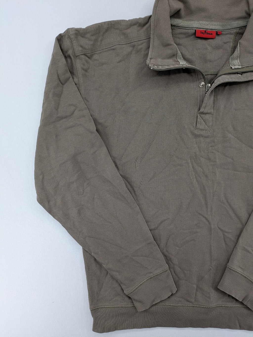 Tony Brown brown turtle neck jumper with embroidered logo and zip button placket.