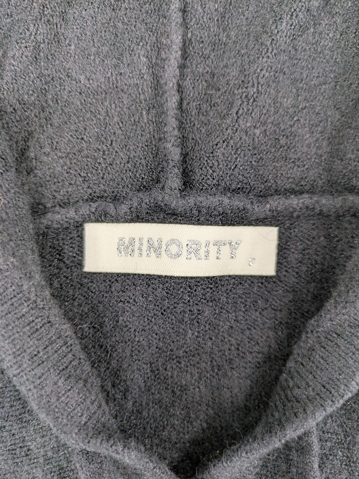 M/L grey hoodie with playful pom-poms and soft viscose blend material.