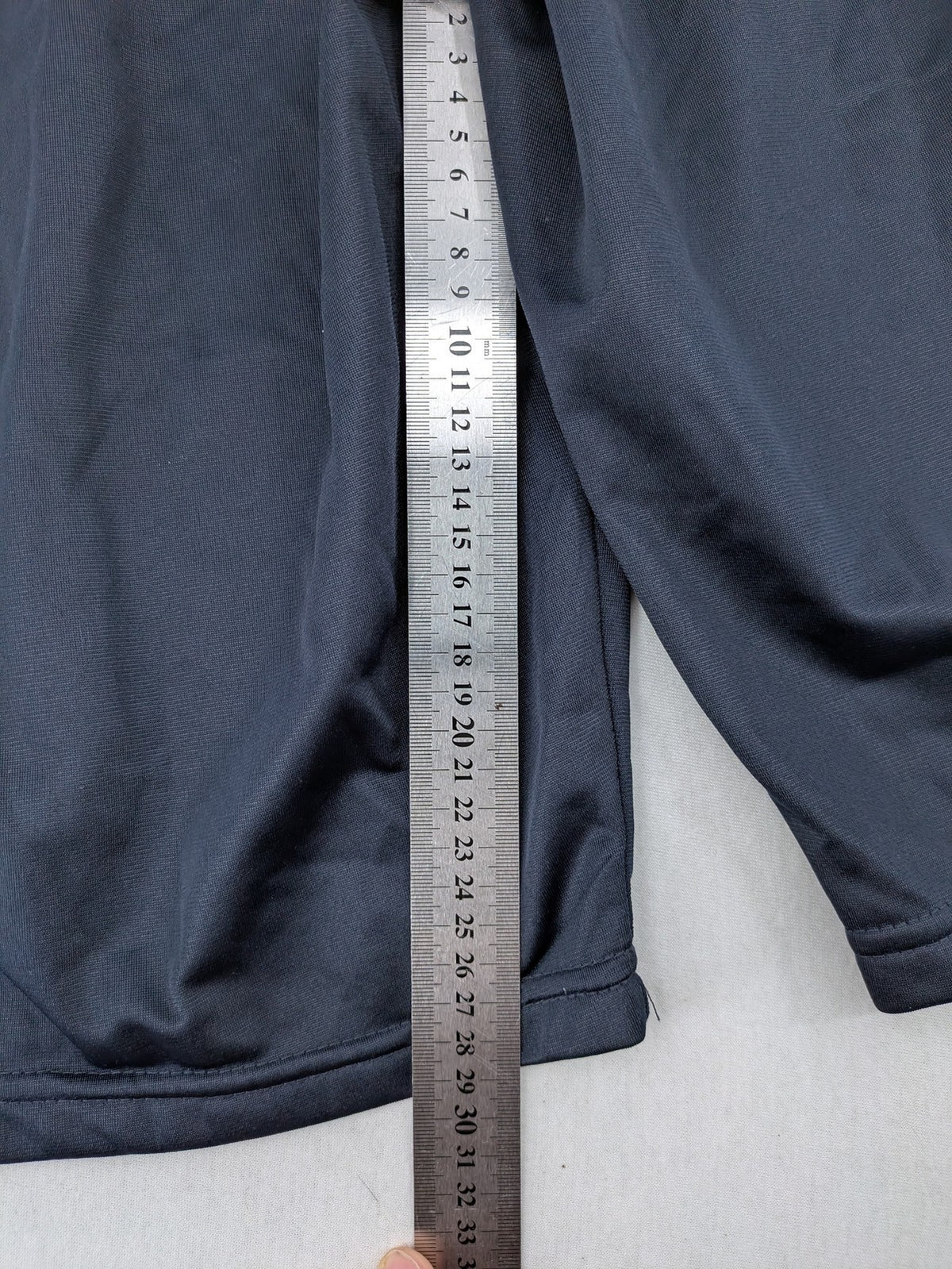 okay grey cargo shorts with green "ATHL. 5 DIVISION" graphic print and side pocket.