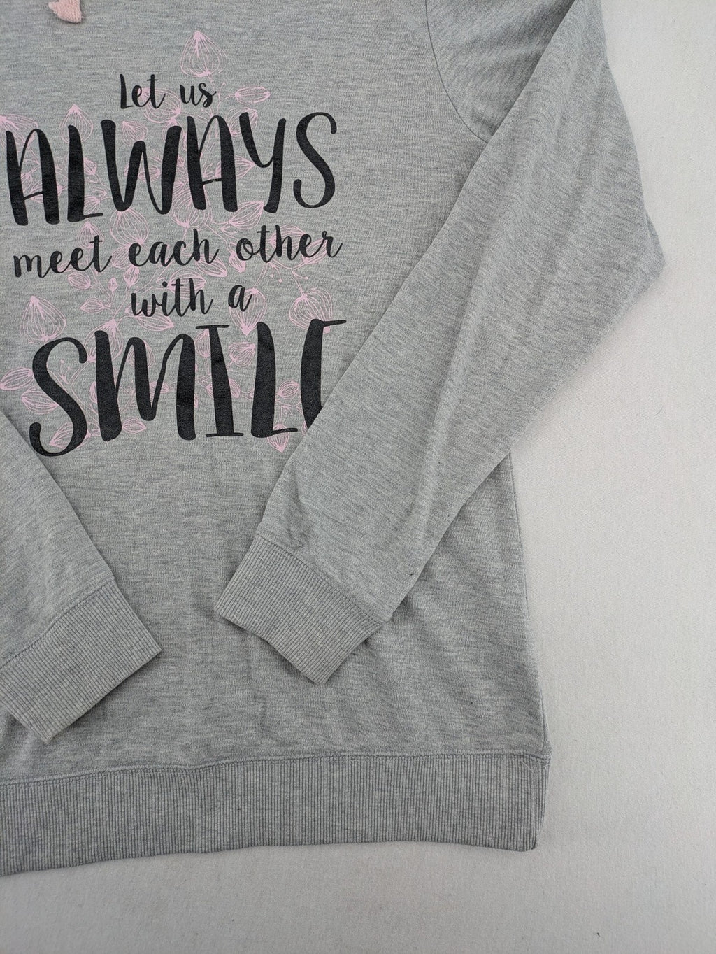 Colours Of The World grey knit jumper with pink drawstring, inspirational graphic print, soft material.