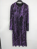 Untold black and purple pleated dress with animal print pattern and long sleeves.