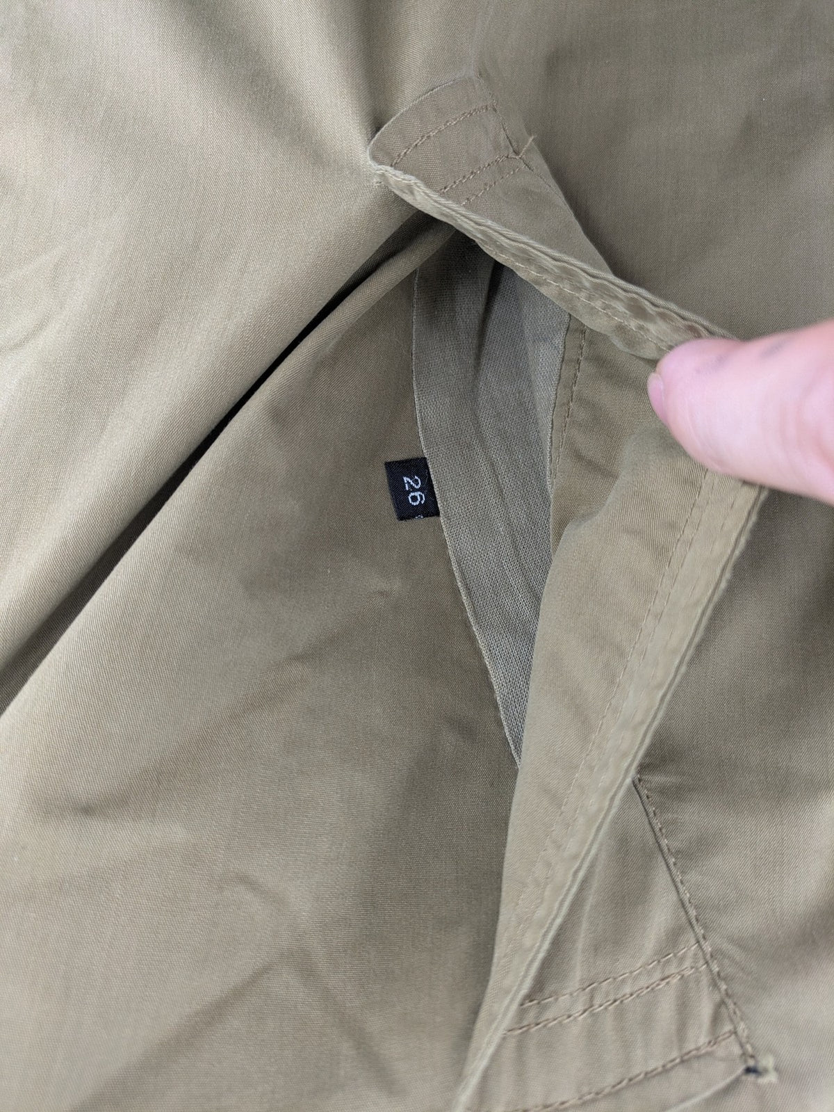 Studio Novum khaki trench coat double-breasted design with belt and wool lining.