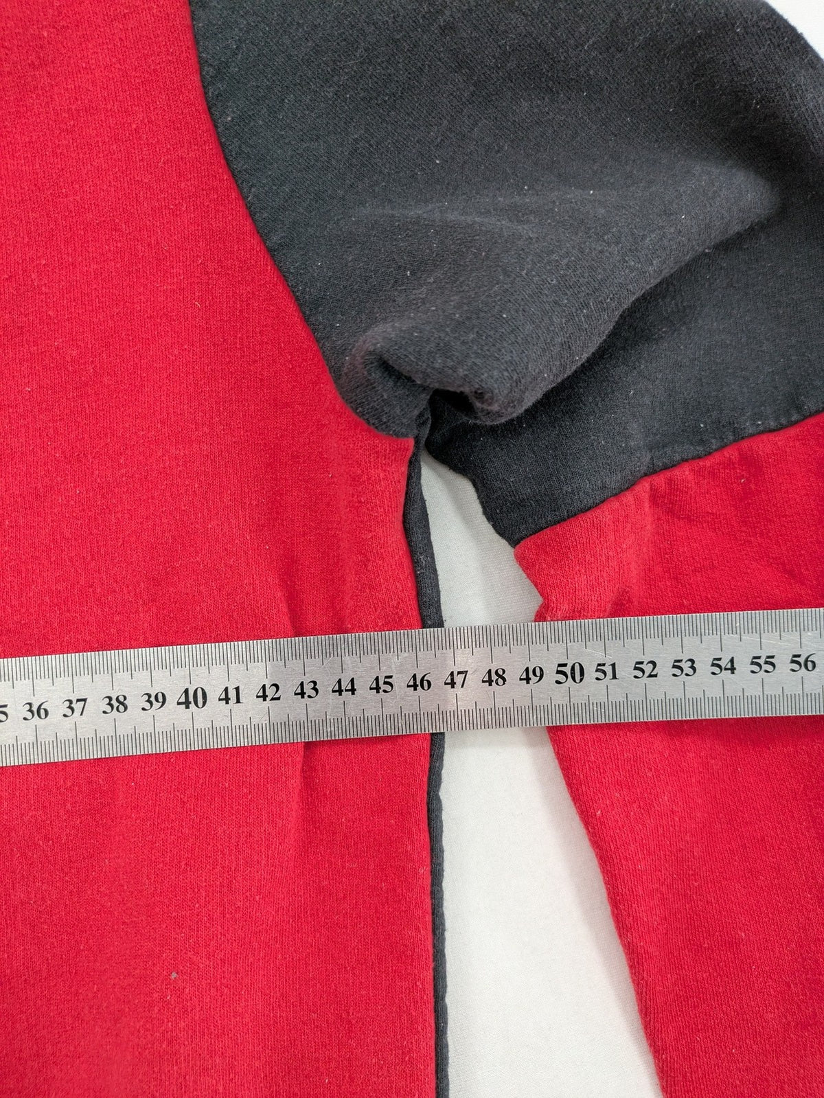 Boystar vintage turtle neck jumper red black colorblock with "MUST FREE YOUR BODY" graphic.