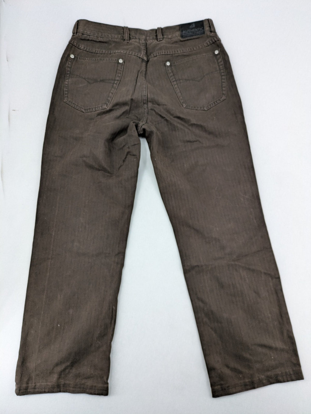 Authentic Clothing Company brown straight jeans with subtle stripe pattern and brand patch.