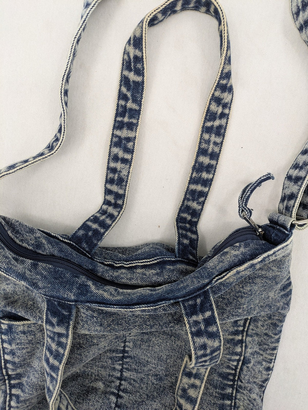 Clockhouse blue acid wash denim tote bag with adjustable shoulder strap and classic handles.